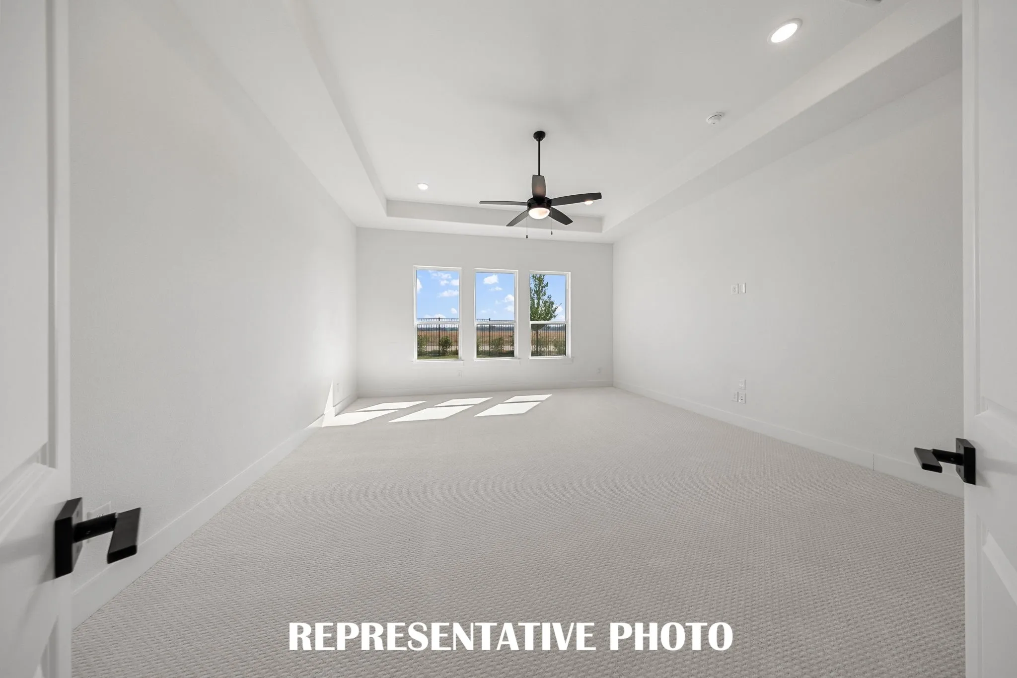 Located at the rear of the home and overlooking the peaceful back yard, this owner's suite was designed for rest and relaxation.  REPRESENTATIVE PHOTO