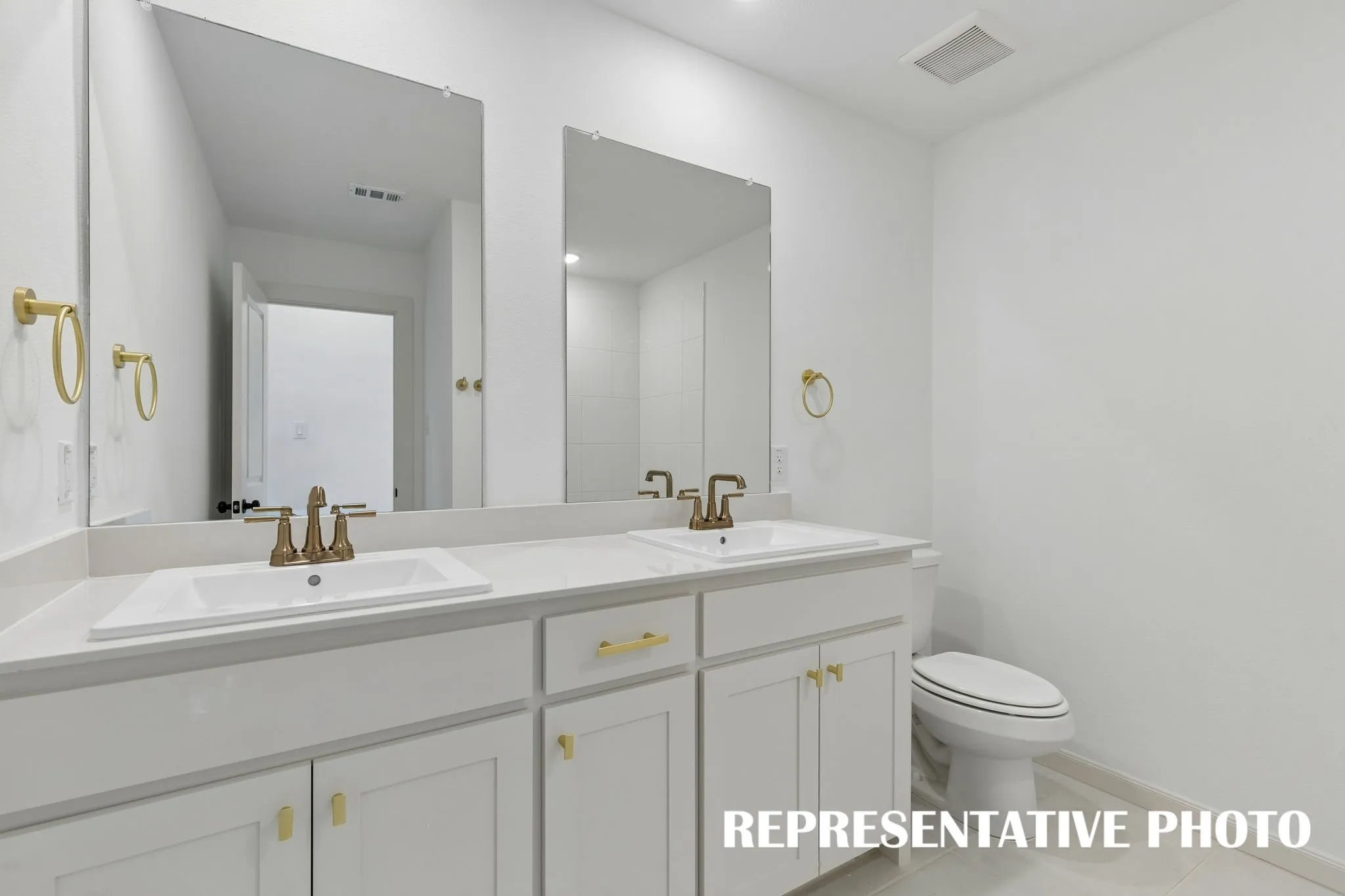 Guests will enjoy their own vanity space in this thoughtfully designed guest bath.  REPRESENTATIVE PHOTO