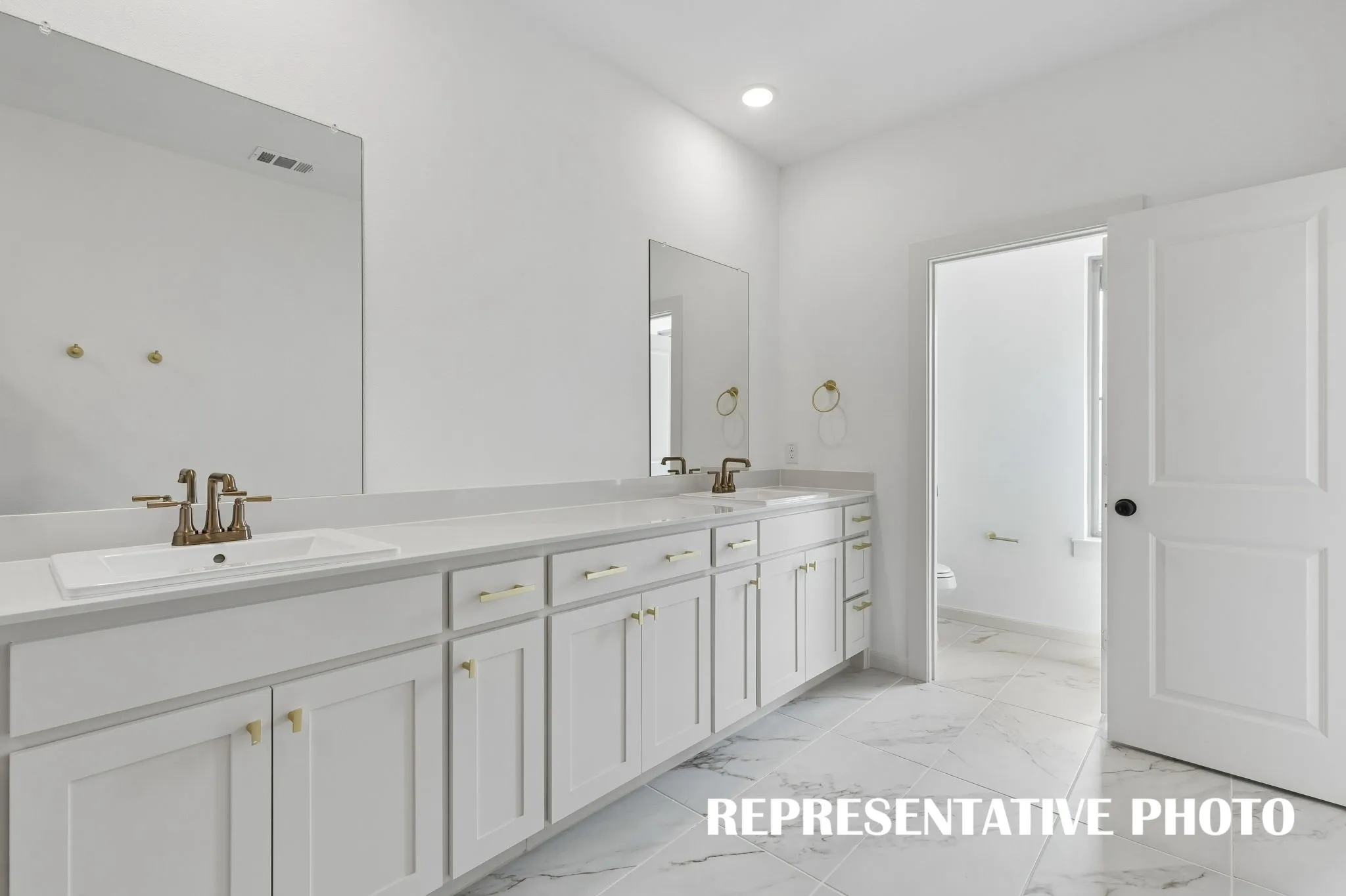 You'll find ample space for two in this wonderful owner's bath.  REPRESENTATIVE PHOTO