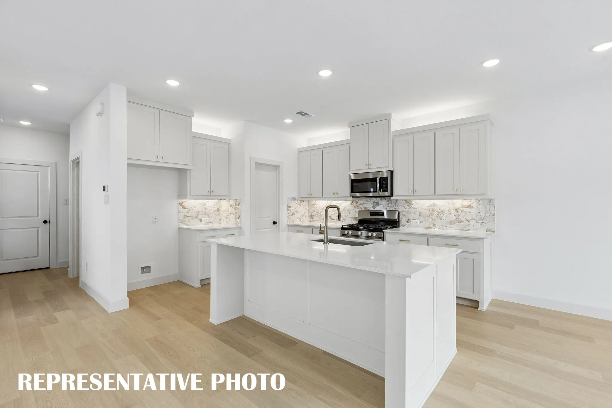 Featuring plenty of storage and prep space, all the chefs in the family will love this dream kitchen!  REPRESENTATIVE PHOTO
