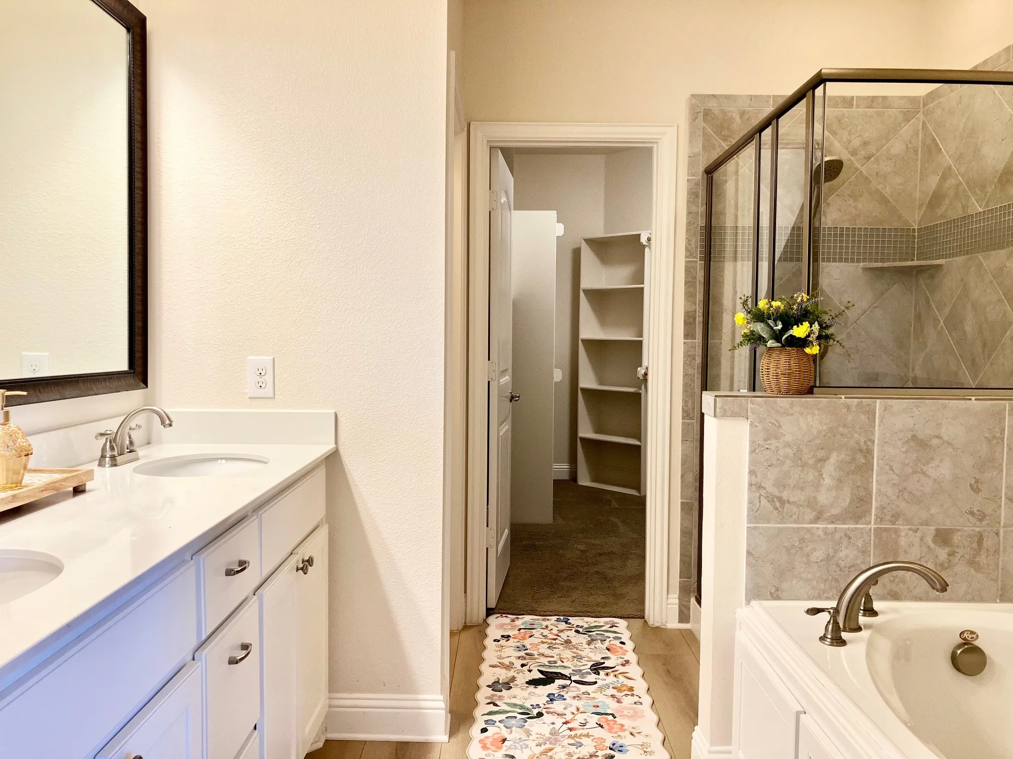 Impeccable! Double sinks, new flooring, tub, shower, toilet room