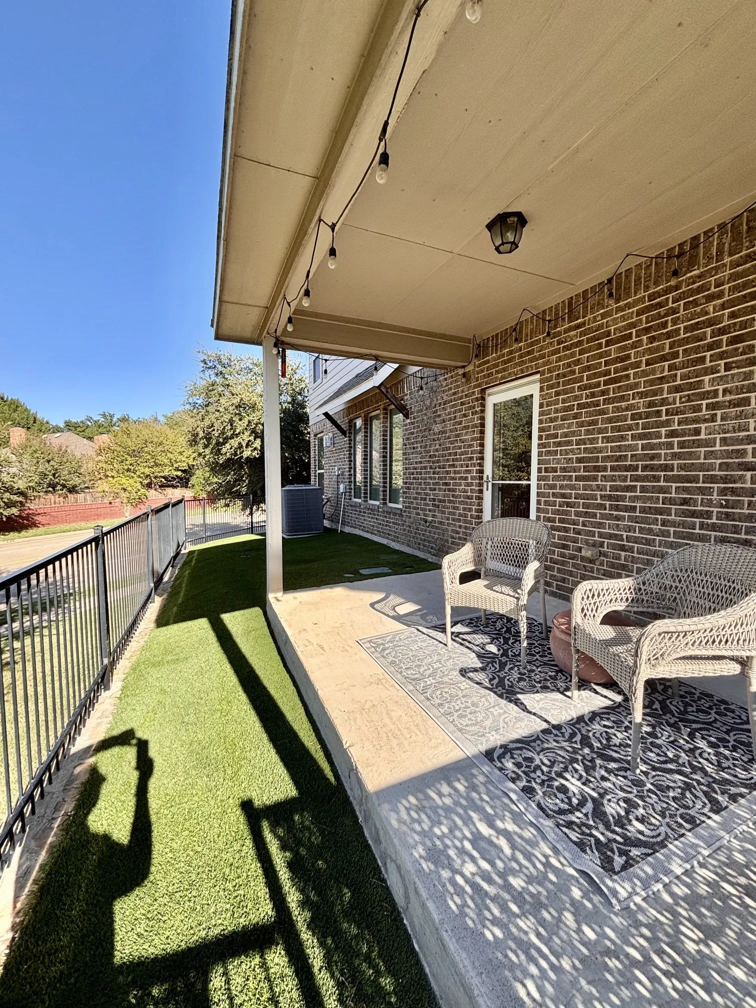 Wrap around covered patio w yard below