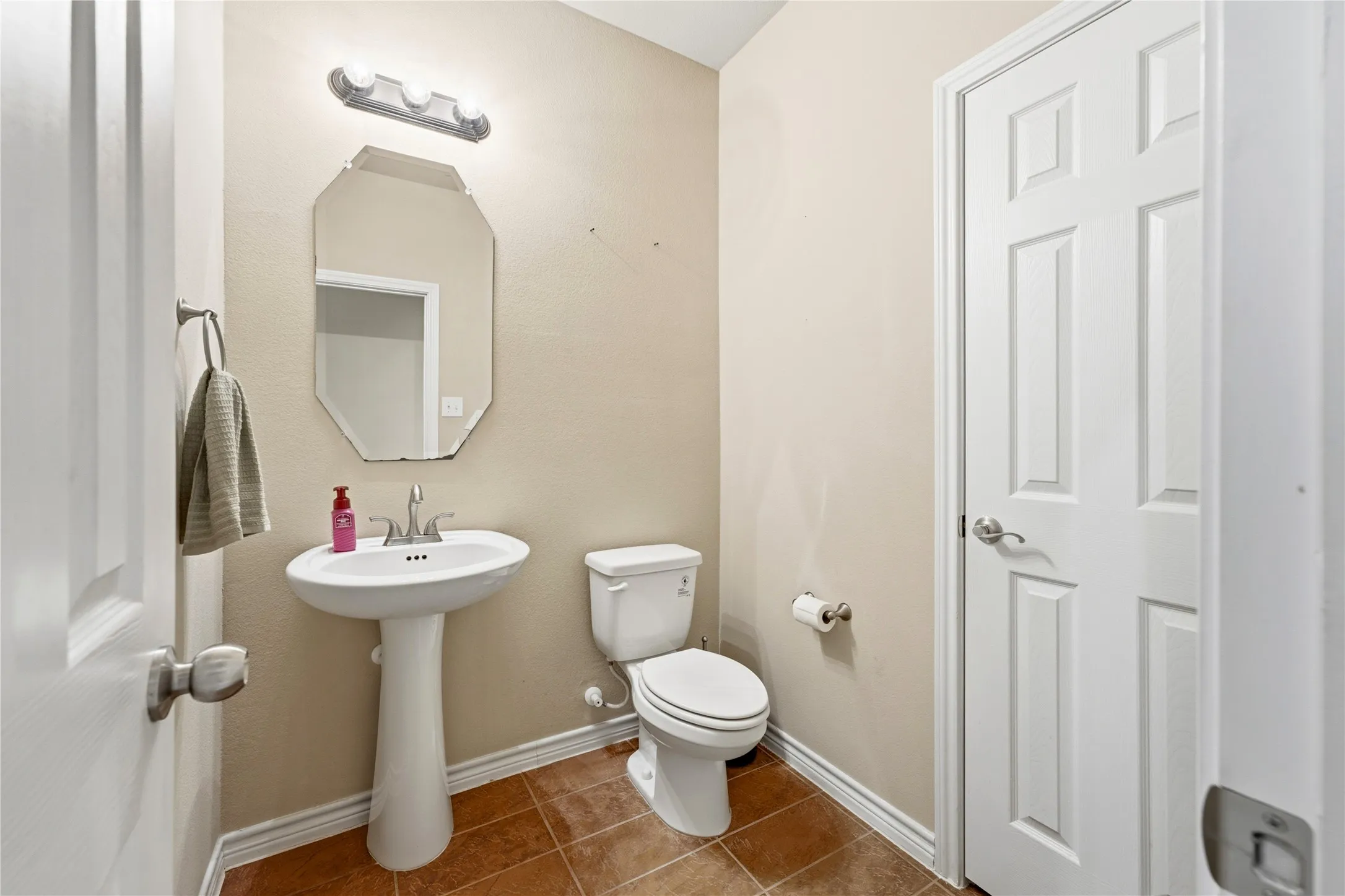 A conveniently located downstairs powder bath, perfect for guests and everyday use.