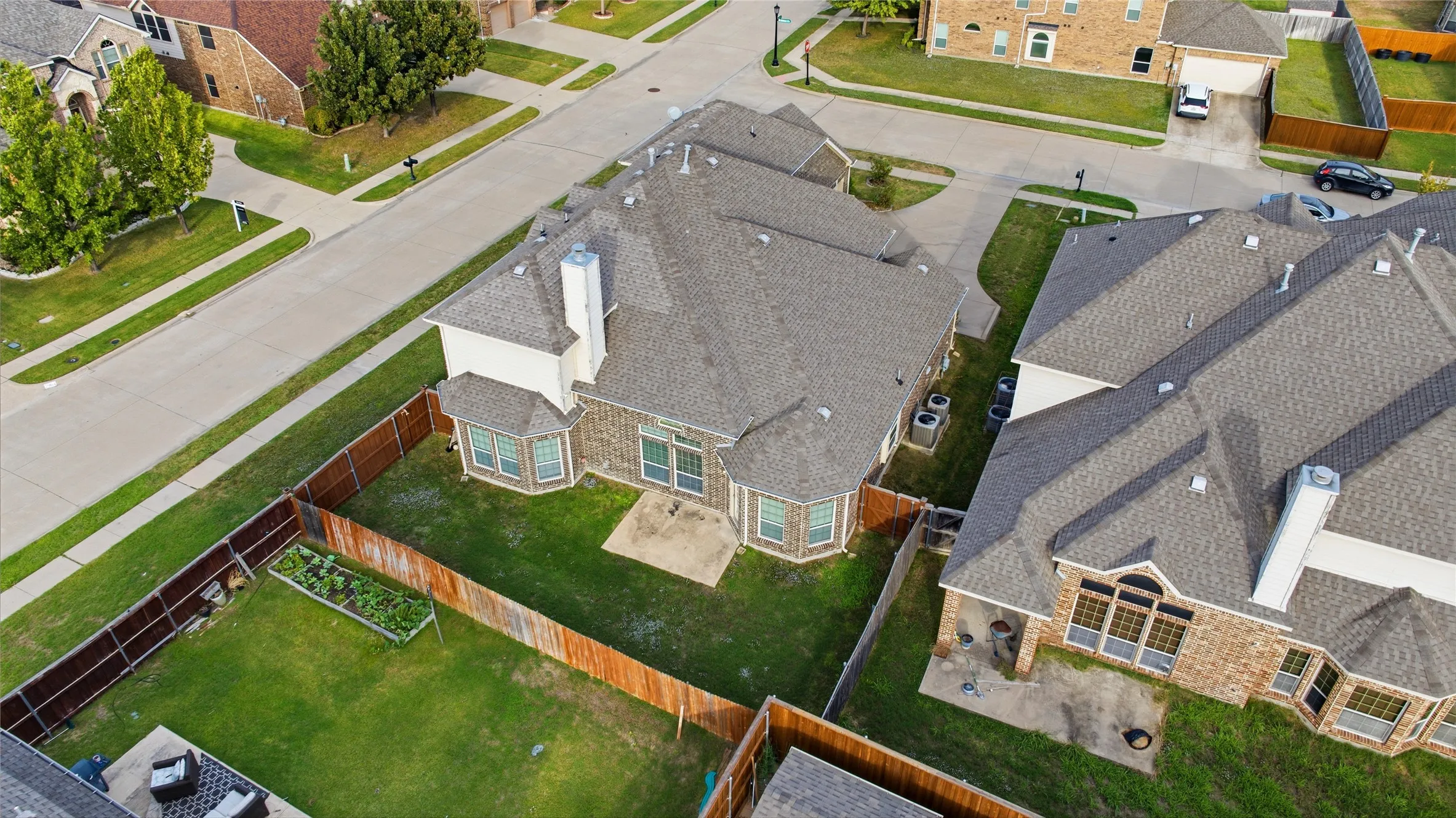 An elevated view showcasing the expansive backyard and surrounding property.