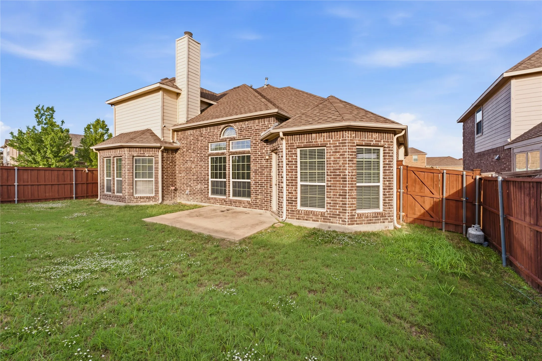 Enjoy the spacious backyard with room to relax, play, and entertain.