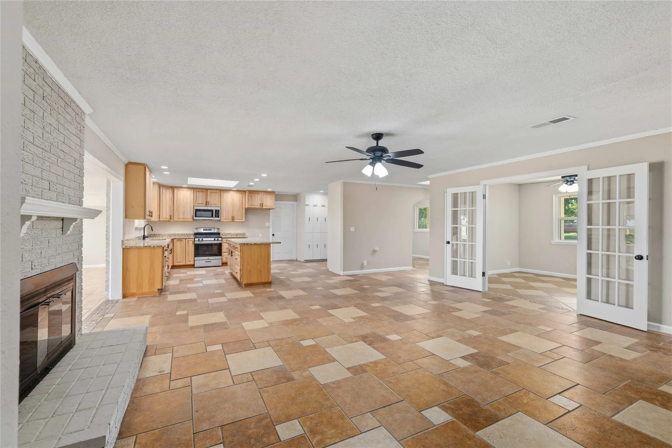 OPEN CONCEPT WITH NEW KITCHEN COUNTEROPS AND CABINETS