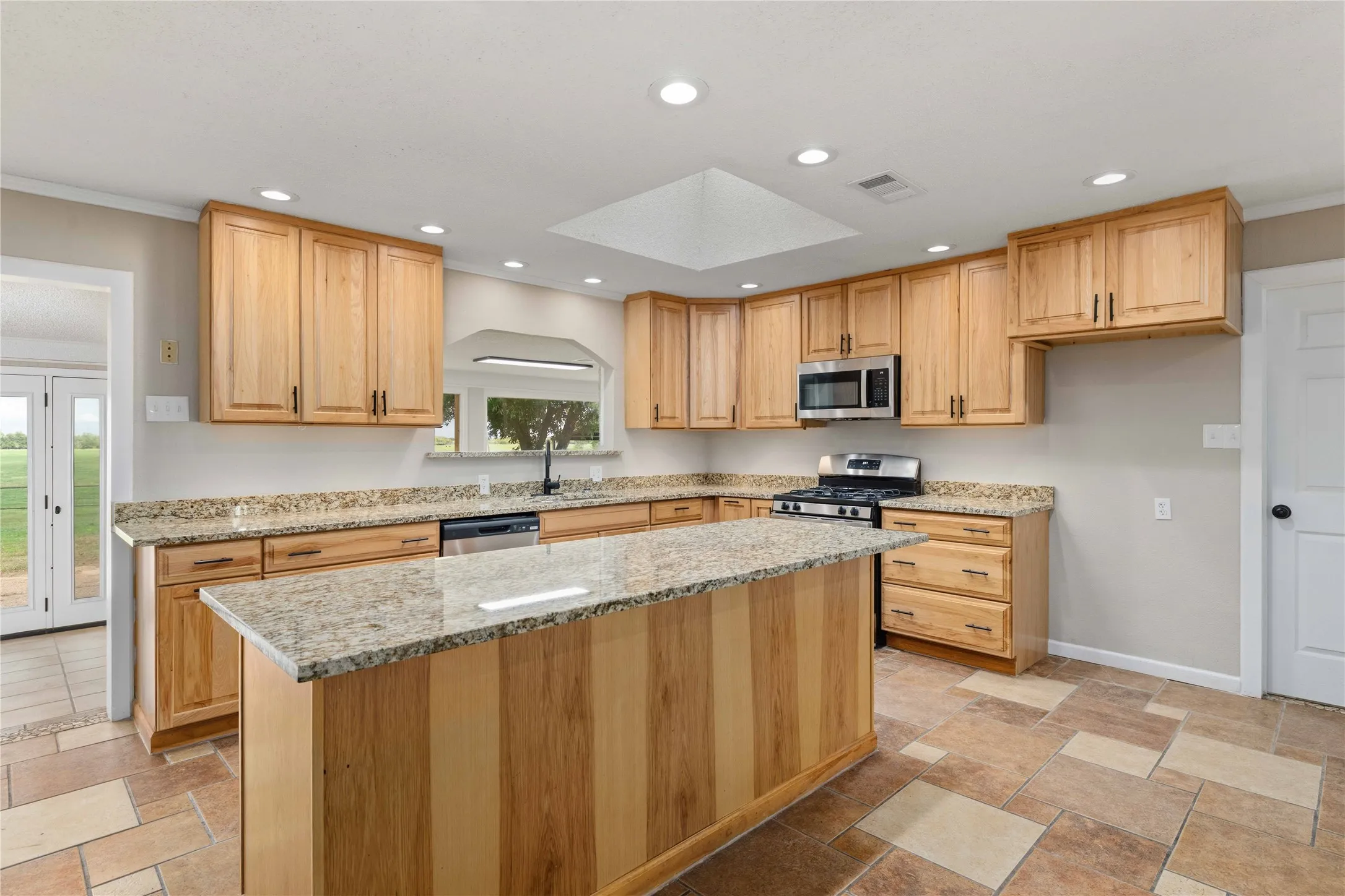 kitchen sink view is out to the open field of neighbors nothing to obstruct your view ..