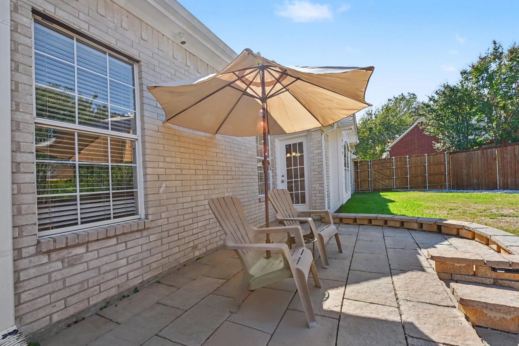 Built-out custom stone patio with lighting