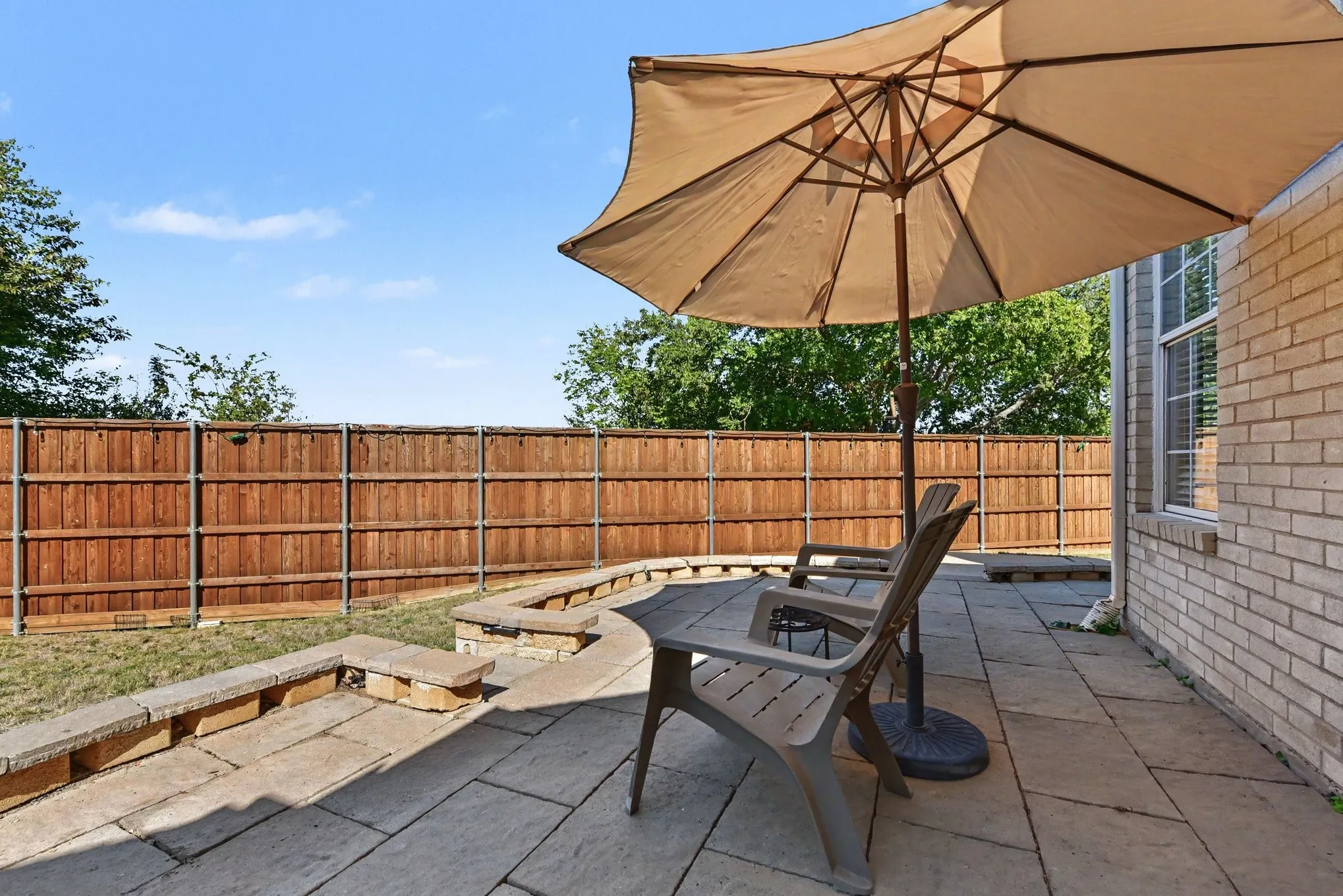 Lovely patio and 8' board on board fence