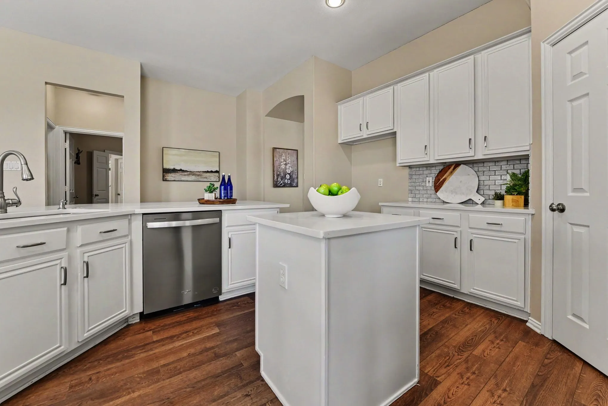 Kitchen with island and breakfast bar, stainless dishwasher