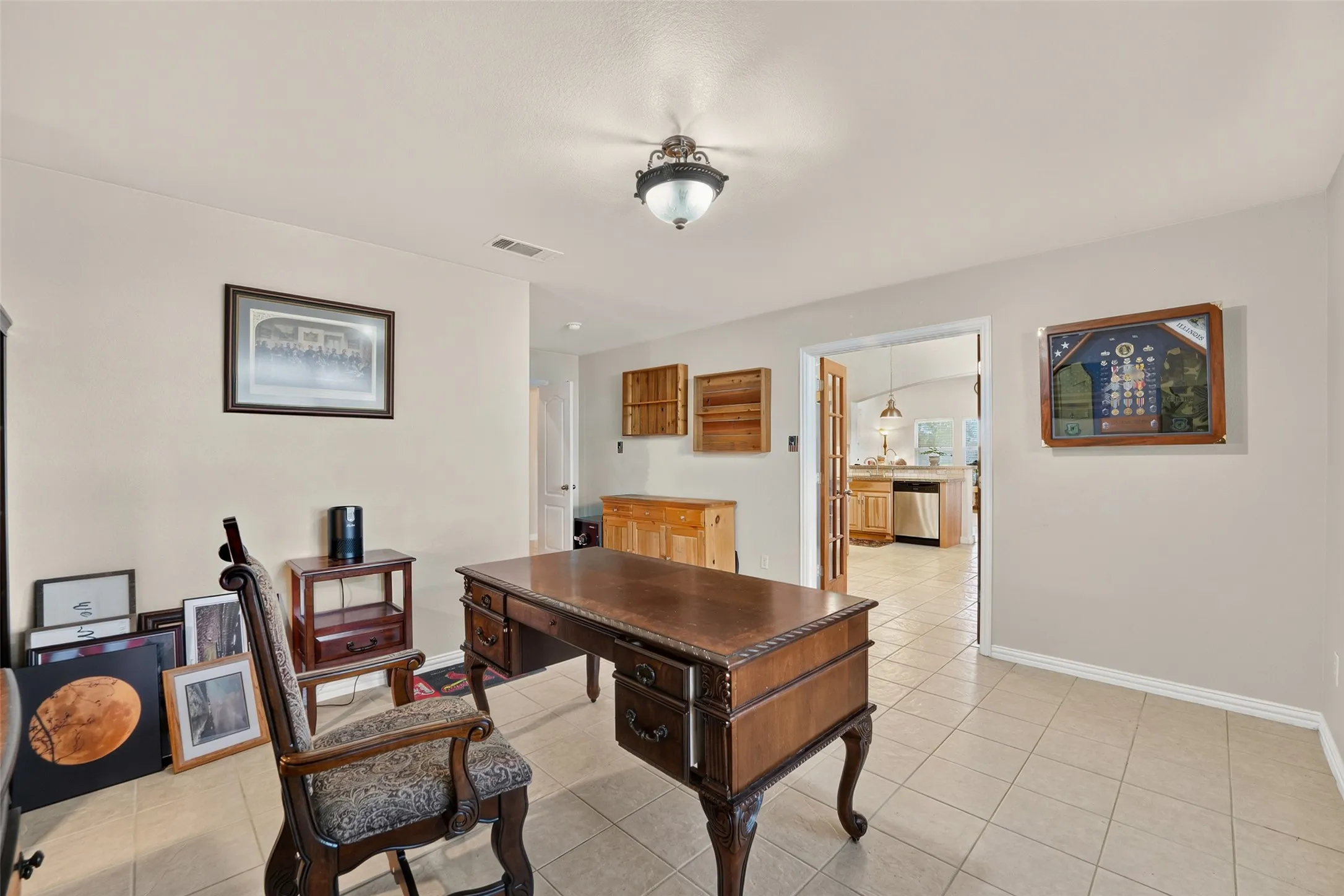 More double doors lead to the kitchen/dining area.