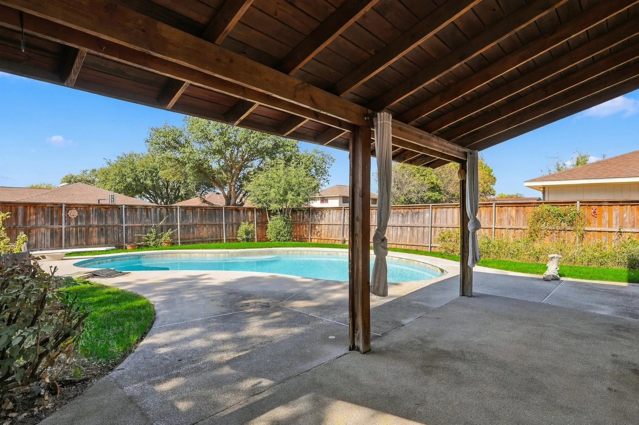 Large covered patio with gorgeous views of the diving pool.