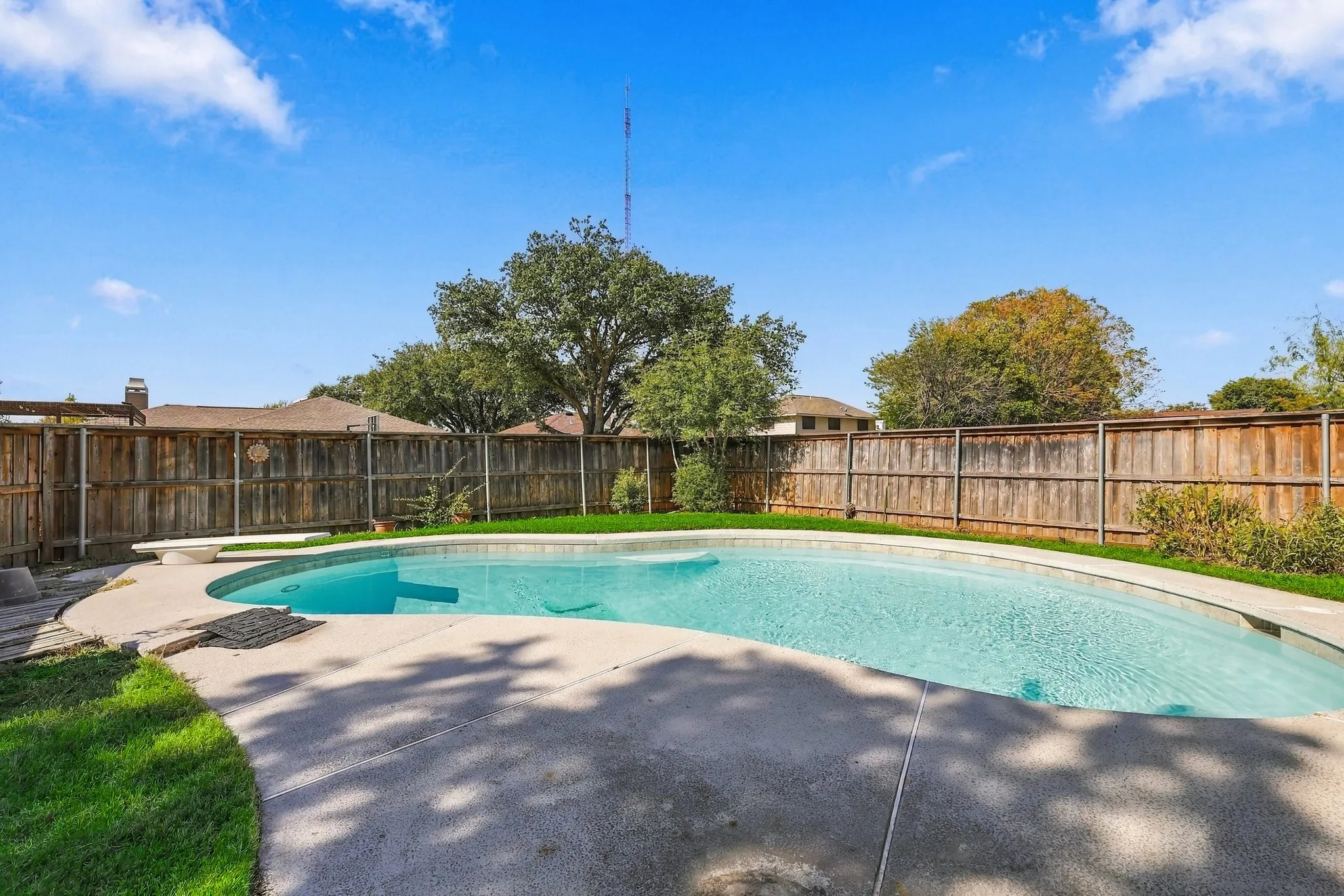 Diving pool with plenty of grass area as well.