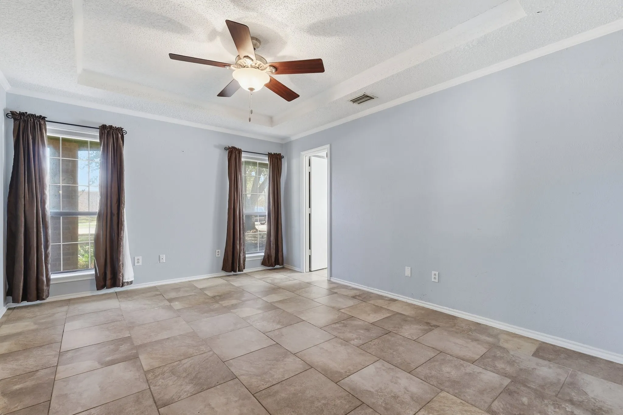 Primary Bedroom with nice natural light and easy living ceramic tile.