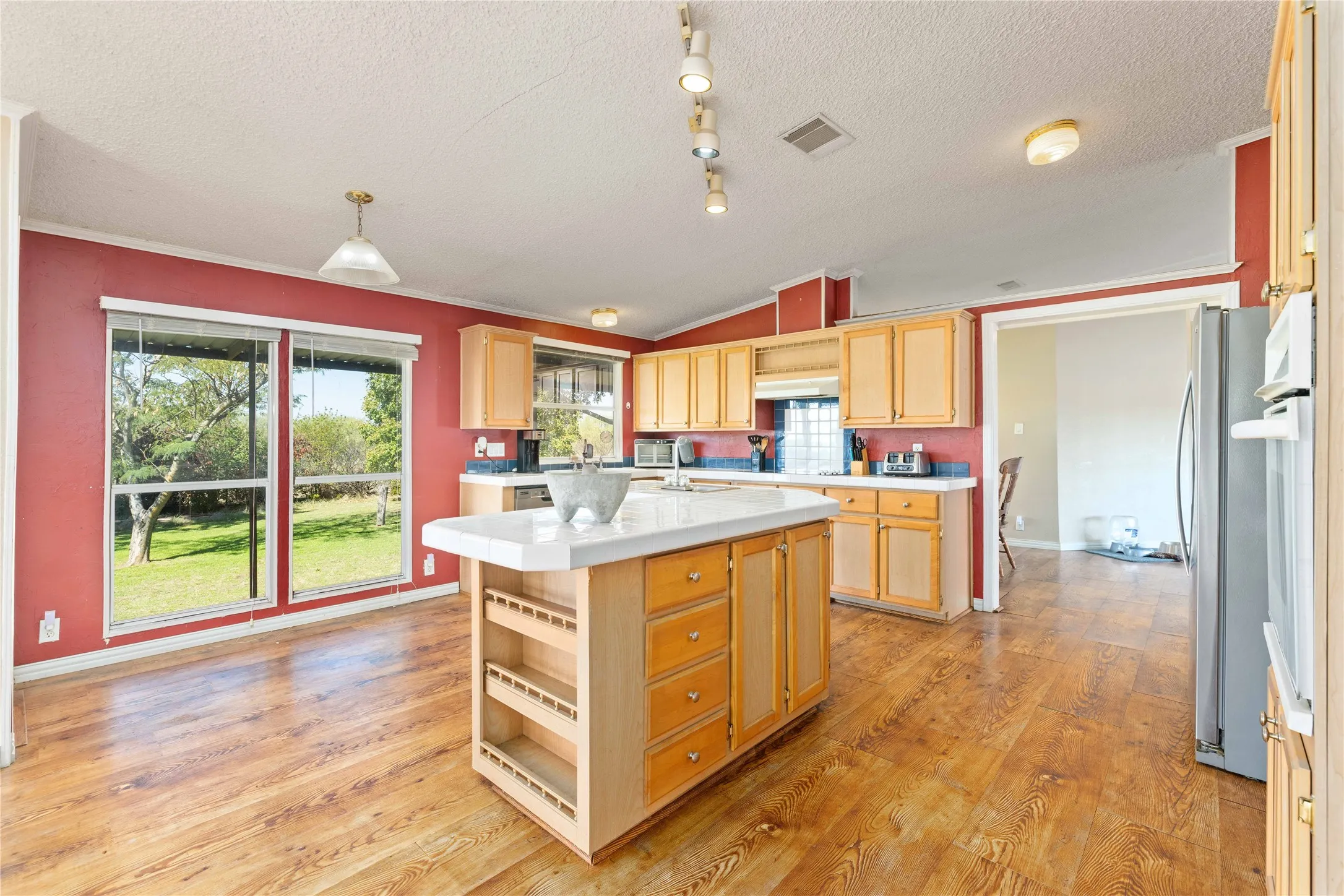 Kitchen has large picture windows for the best view of your 28 acres, the doorway that is on the right side of the kitchen leads to a formal dining room and living room.