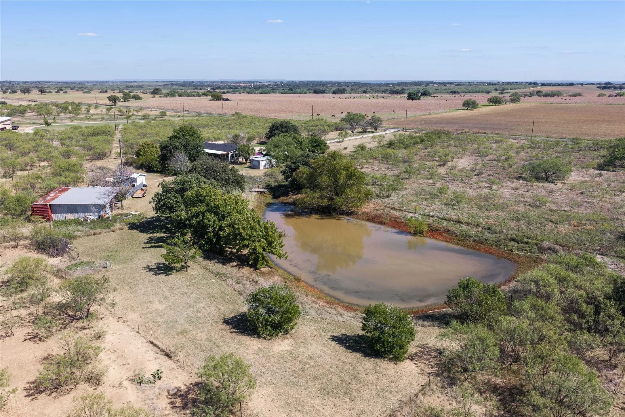 Large pond, Shop, 2 sheds, and a 3-bed, 2-bath home on 28 acres!