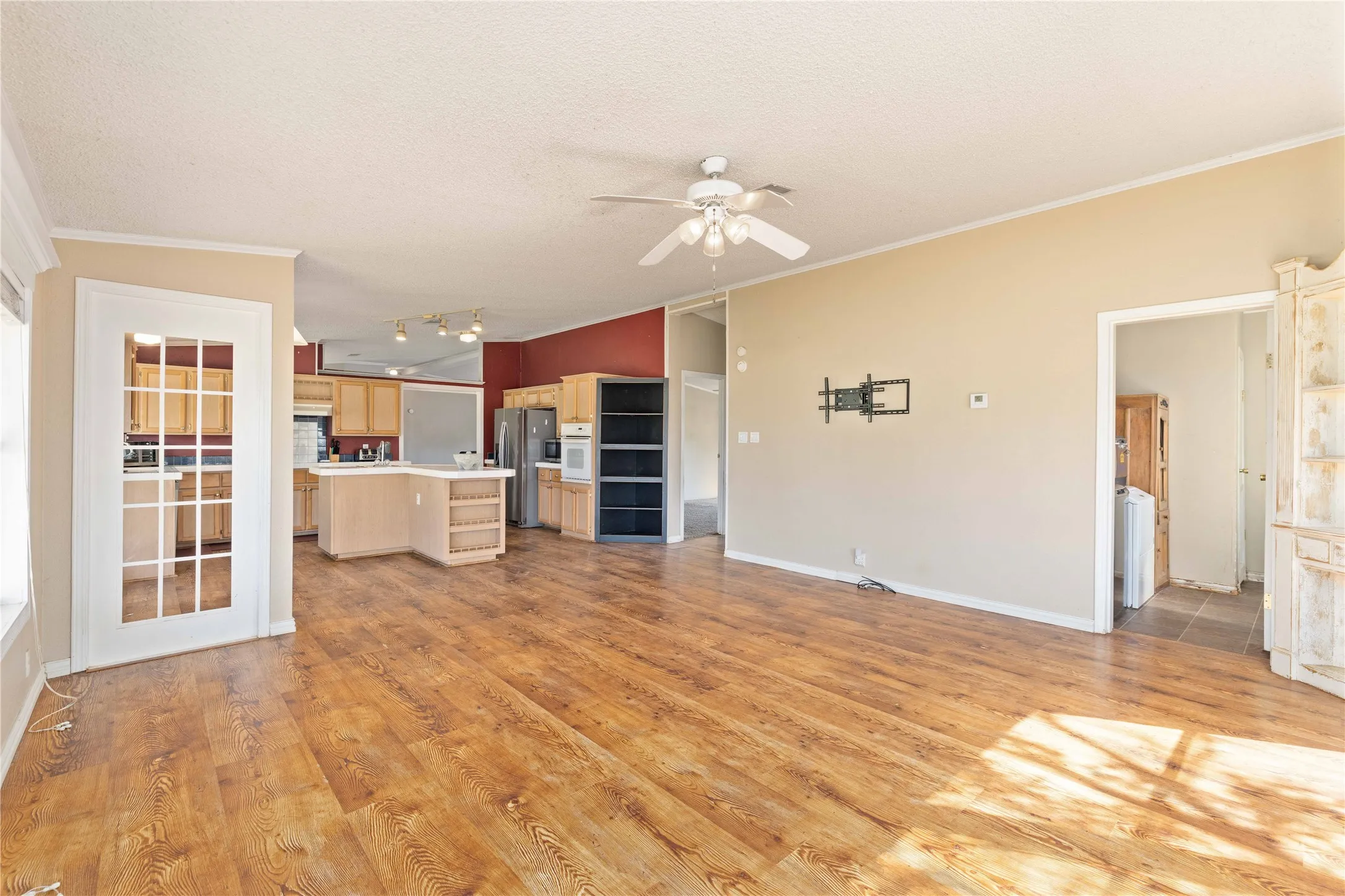 View from the family room of the kitchen, laundry room and to the left is a hall to 2 bedrooms and a bathroom