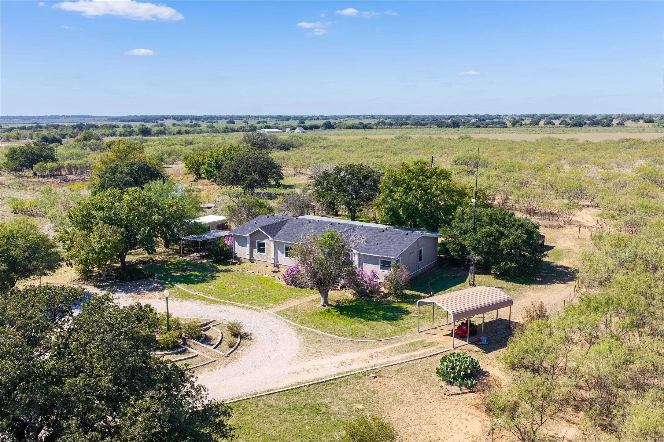 1700 CR 153 Brownwood home on 28 Acres with covered parking, shop and large pond!