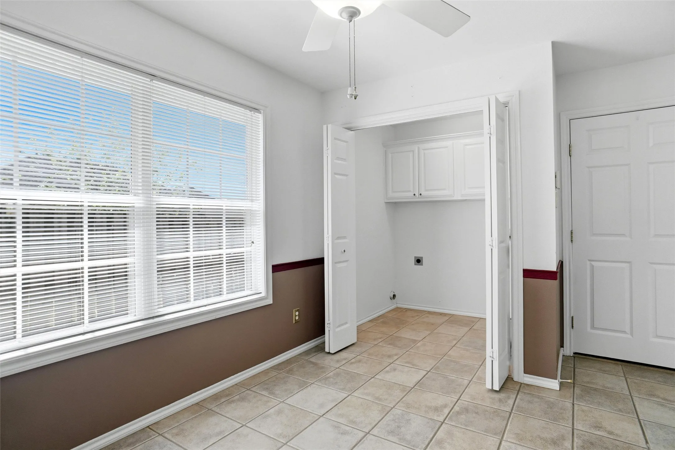 Laundry room is conveniently located off the breakfast area.