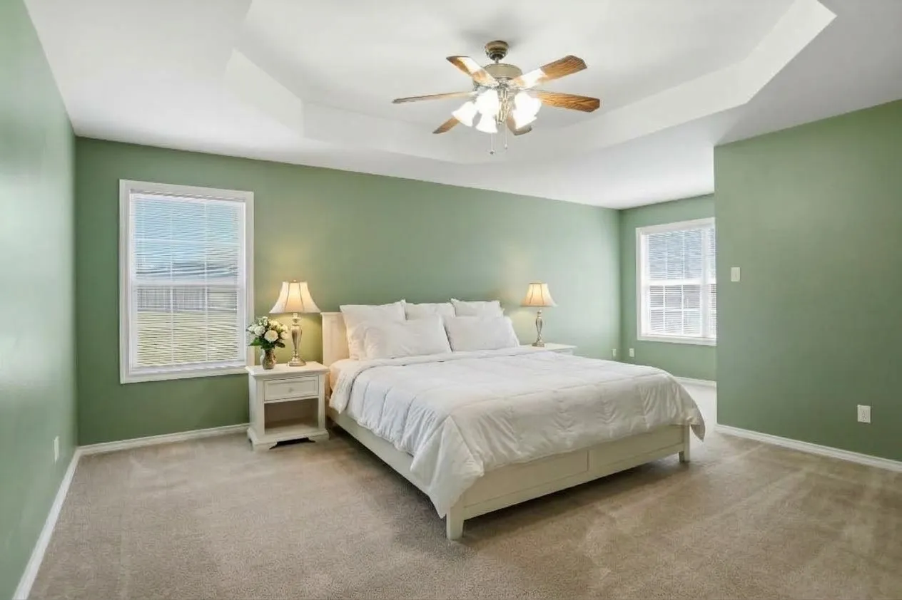 AI enhanced photo.  Tray ceiling with a ceiling fan