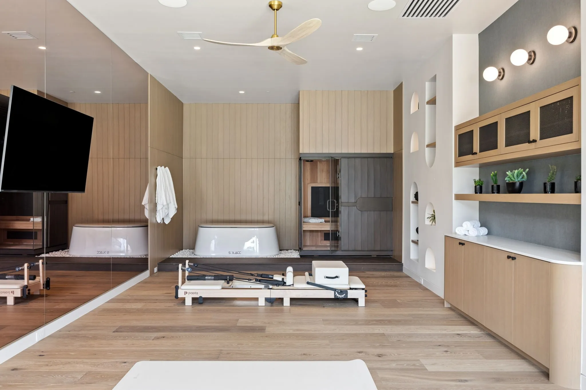 Separate Wellness Retreat with full Kitchen, Family Room, Wellness area with Infrared Sauna + Cold Plunge, and separate Guest Bedroom with ensuite Bath.
