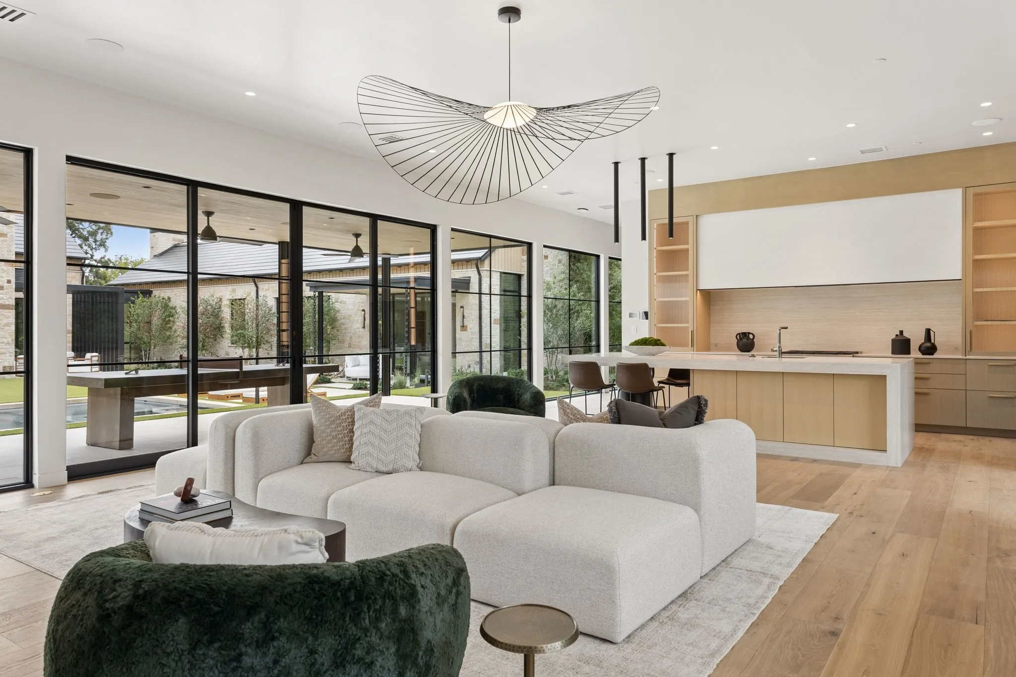 Separate Wellness Retreat with full Kitchen, Family Room, Wellness area with Infrared Sauna + Cold Plunge, and separate Guest Bedroom with ensuite Bath.