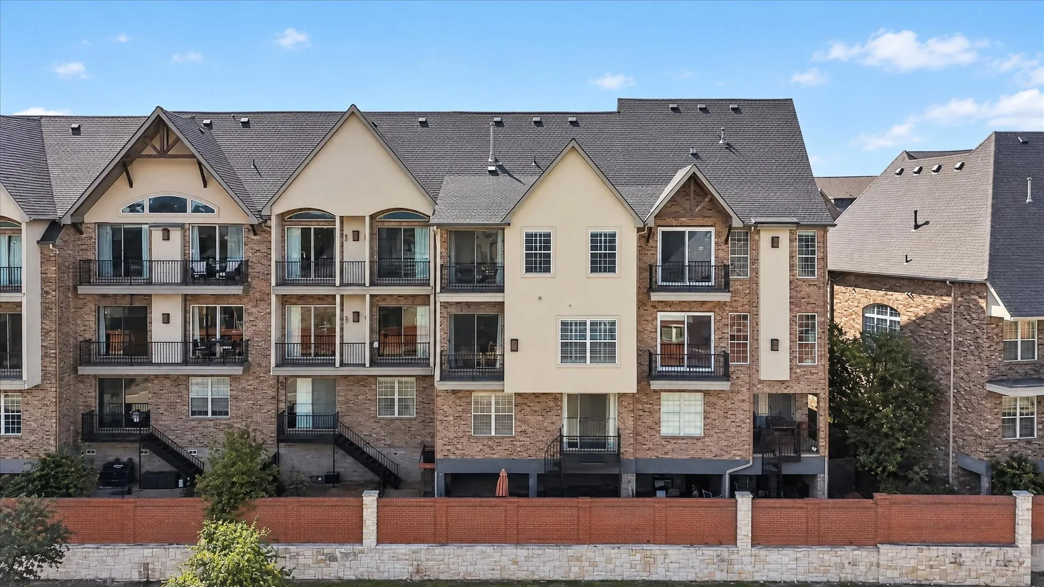 Aerial View of the back of the bulding, showing the balconies and the covered patio.