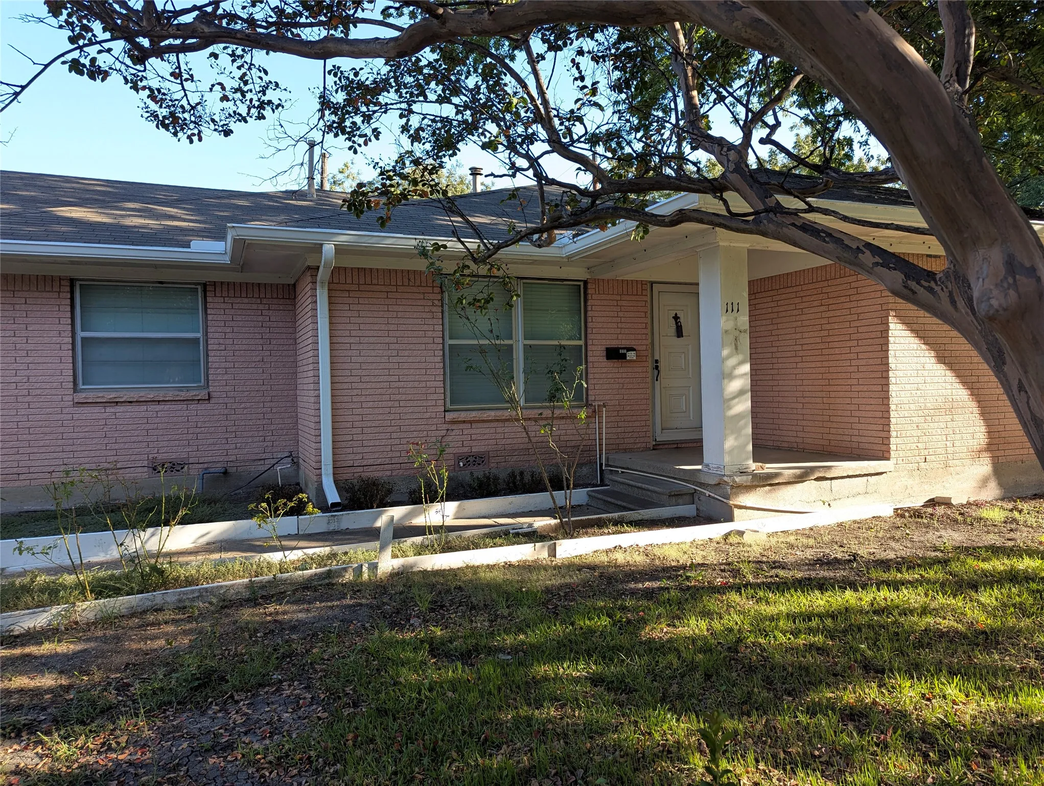 Welcoming covered front porch shaded by a beautiful mature tree. An opportunity to give this established Farmersville home a fresh new look!