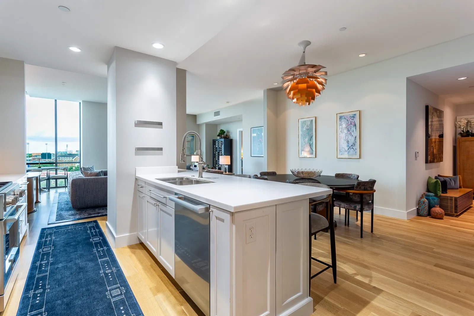 Quartz counters and white cabinetry.