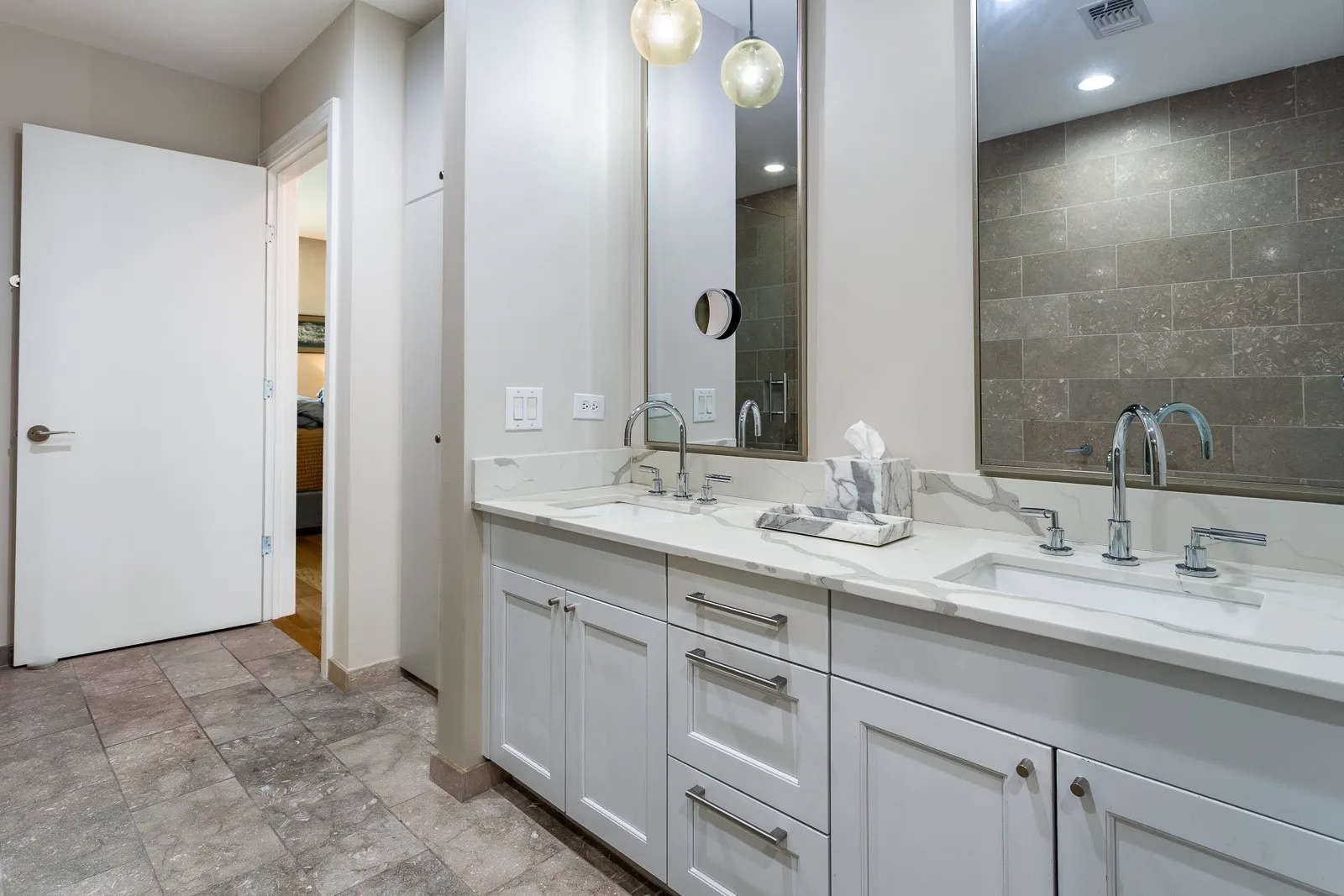 Double vanity with quartz counters & Dornbracht fixtures.
