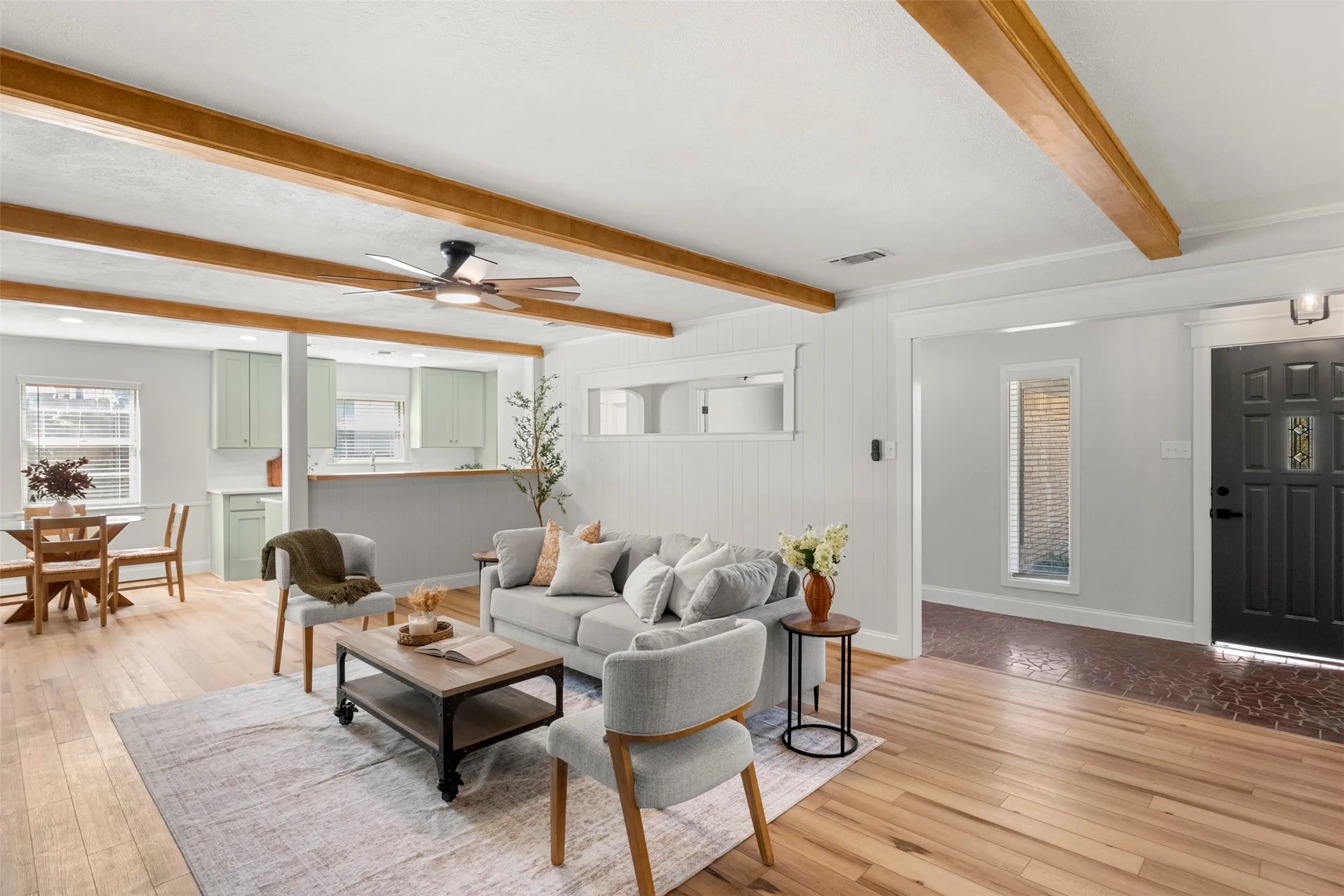The spacious living room connects naturally to the kitchen and dining spaces, making everyday living and entertaining easier.