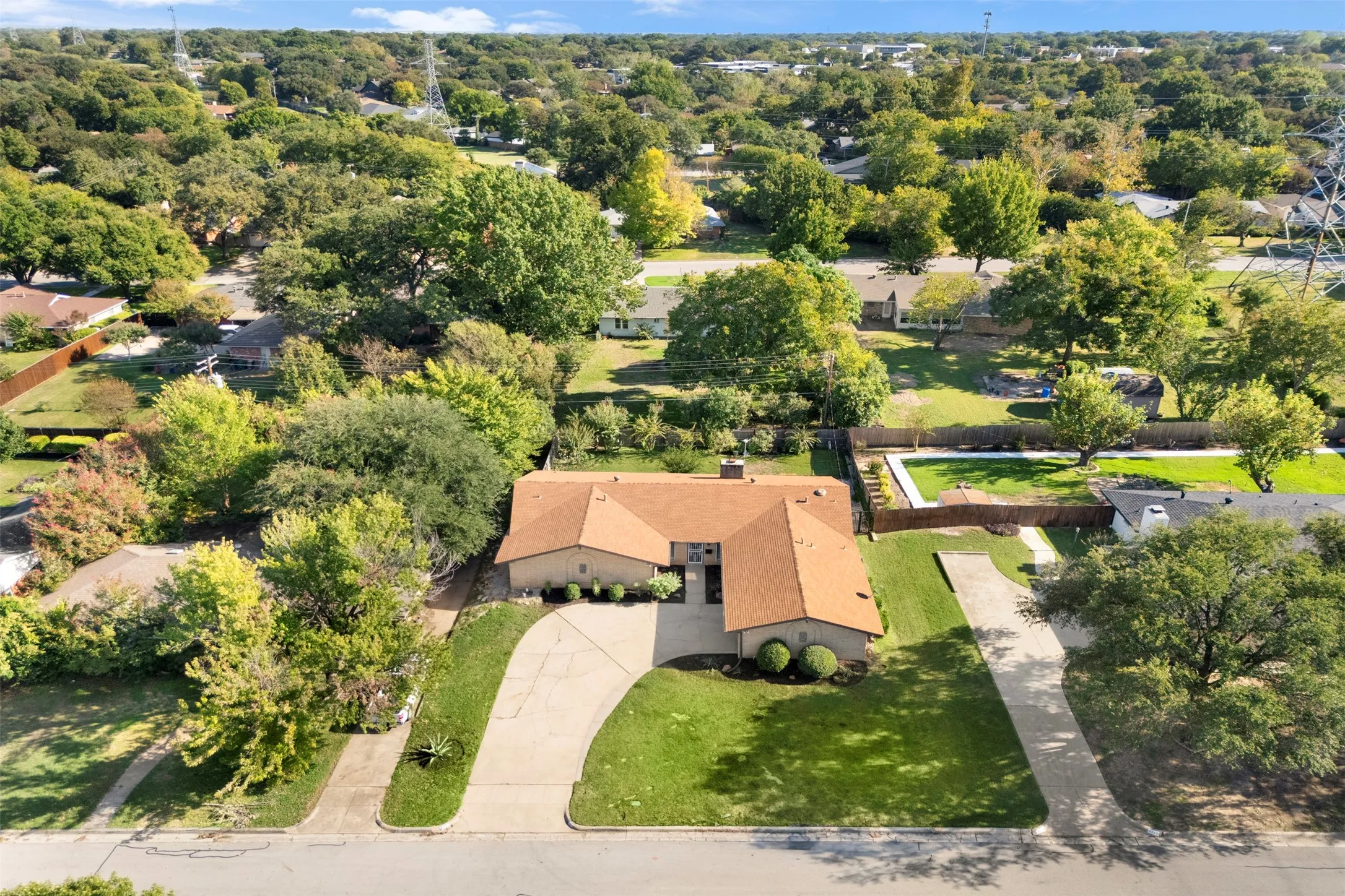 An aerial perspective shows the home's setting within Fort Worth's established Wedgwood neighborhood.