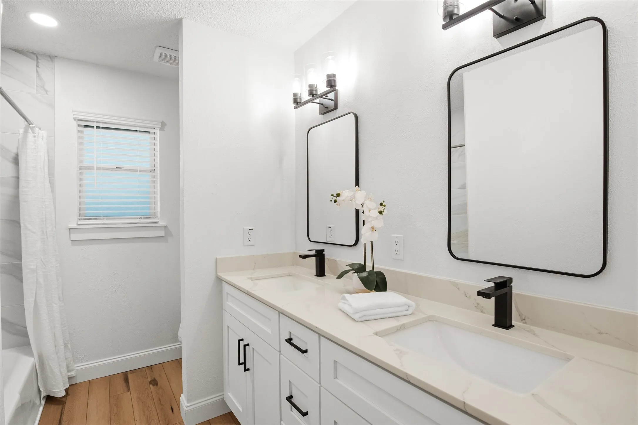 Both full bathrooms feature double vanities, giving households extra counter space and storage.