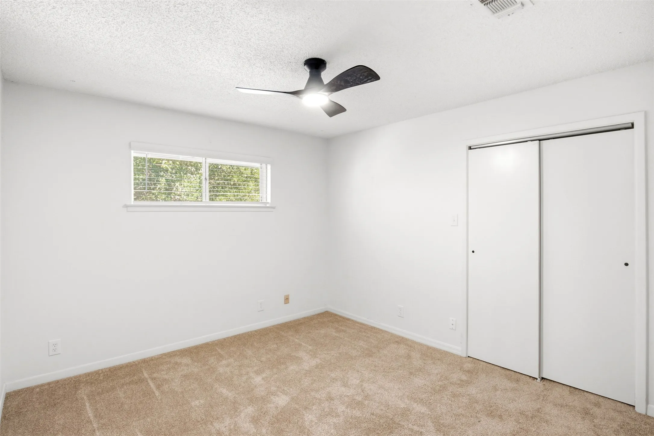 A comfortable secondary bedroom ready for guests, family, or whatever your needs may be.