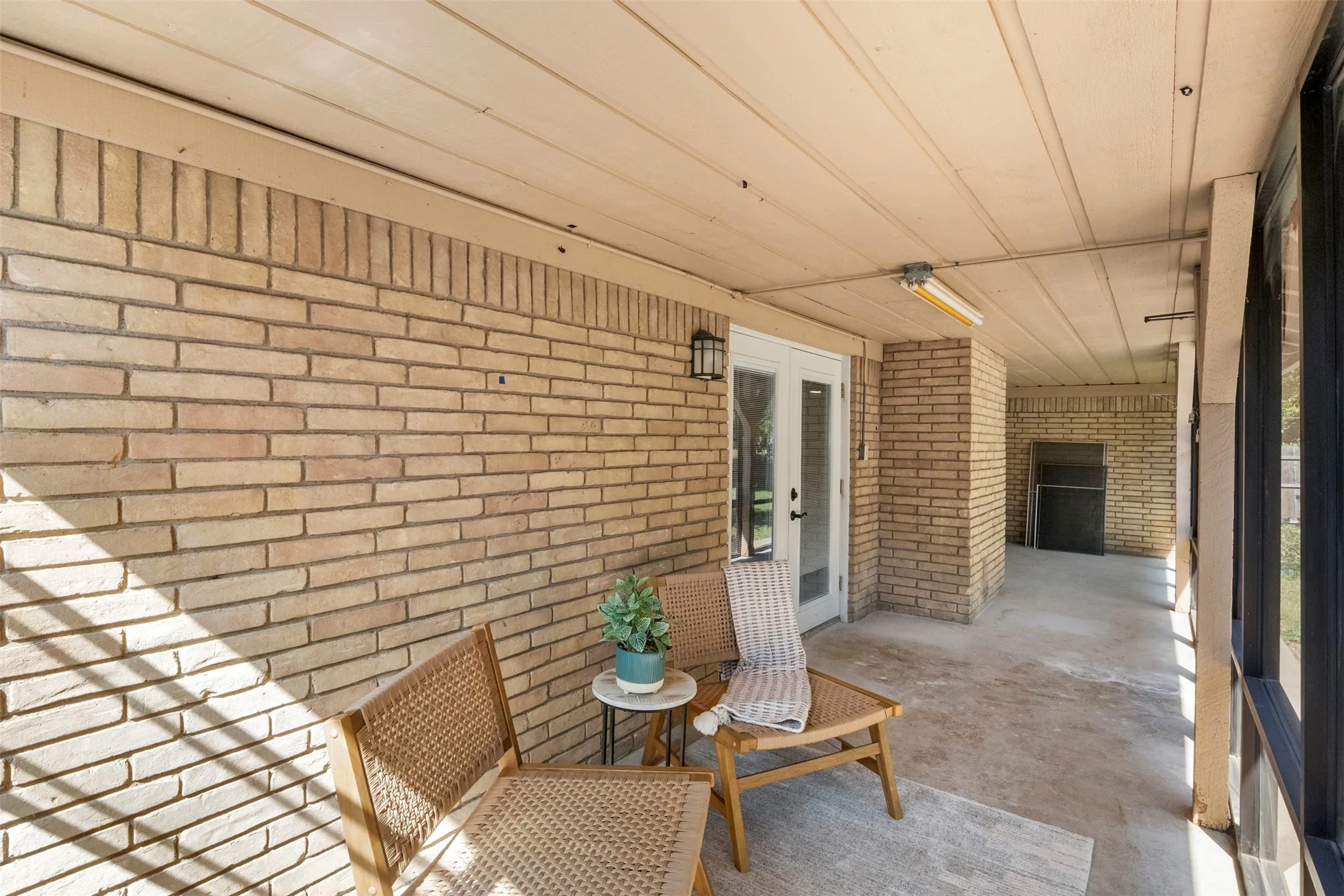 A spacious screened porch creates another place to relax, entertain, or enjoy the backyard.