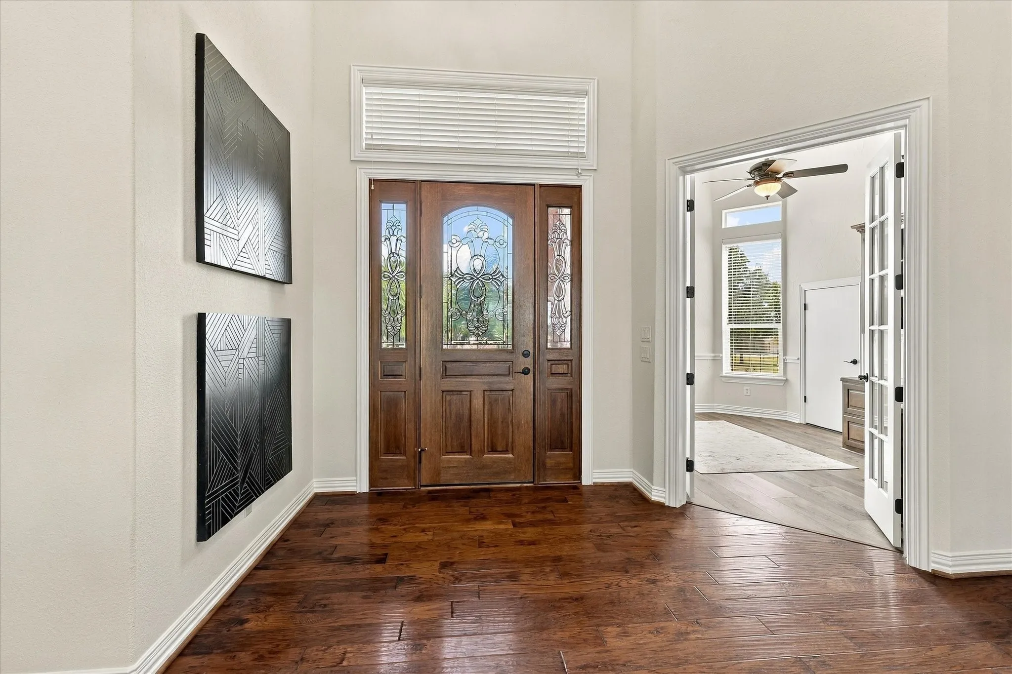 Grand knotty alder door with glass sidelights.  Office entry to the right.