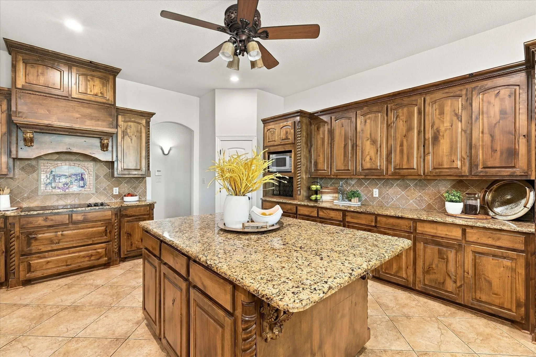 TONS of cabinets and counterspace.   Note the elegant scrollwork on cabinets.