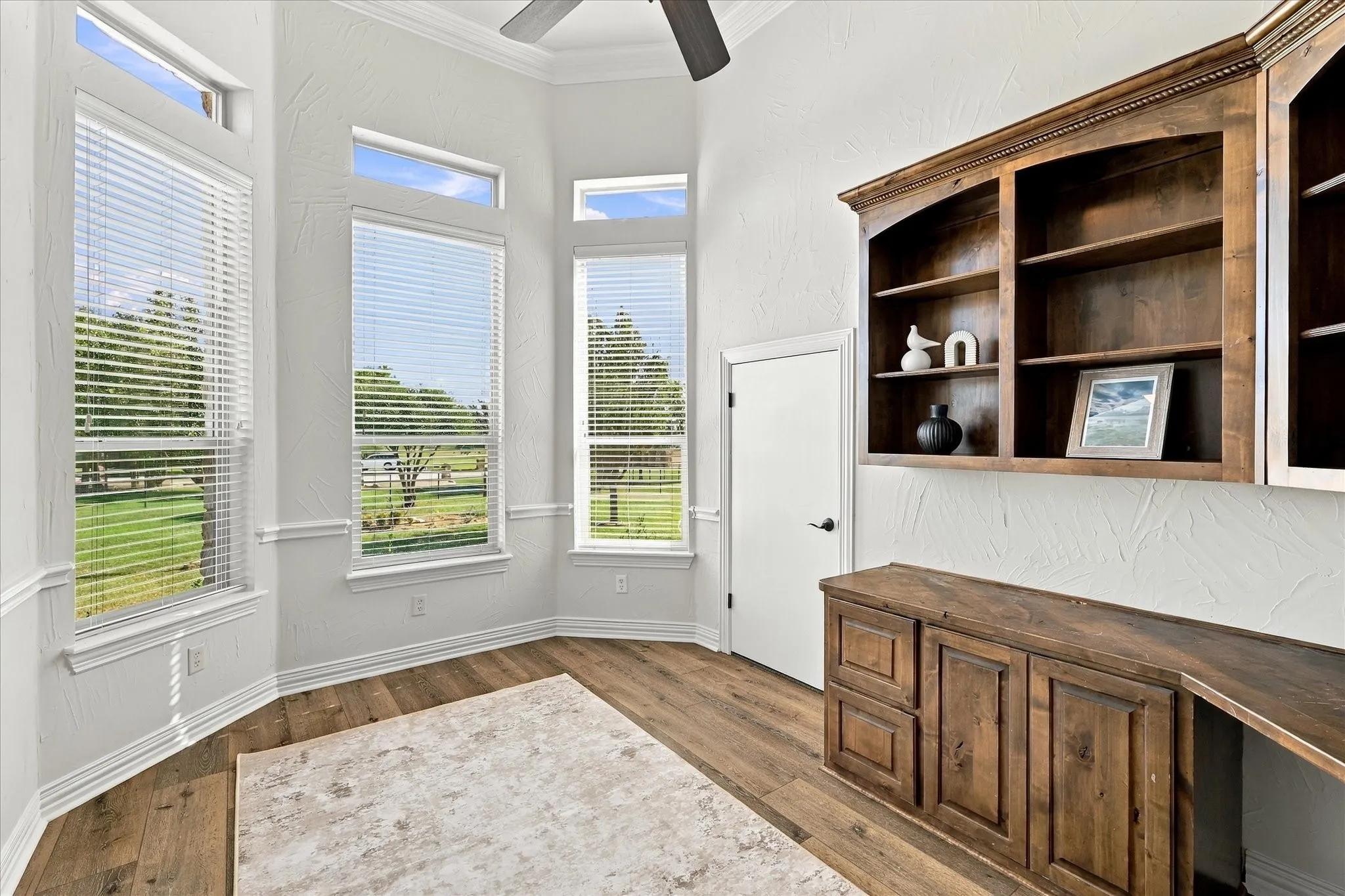 Office overlooking front acreage.  Note door to large, under-stairway storage area.