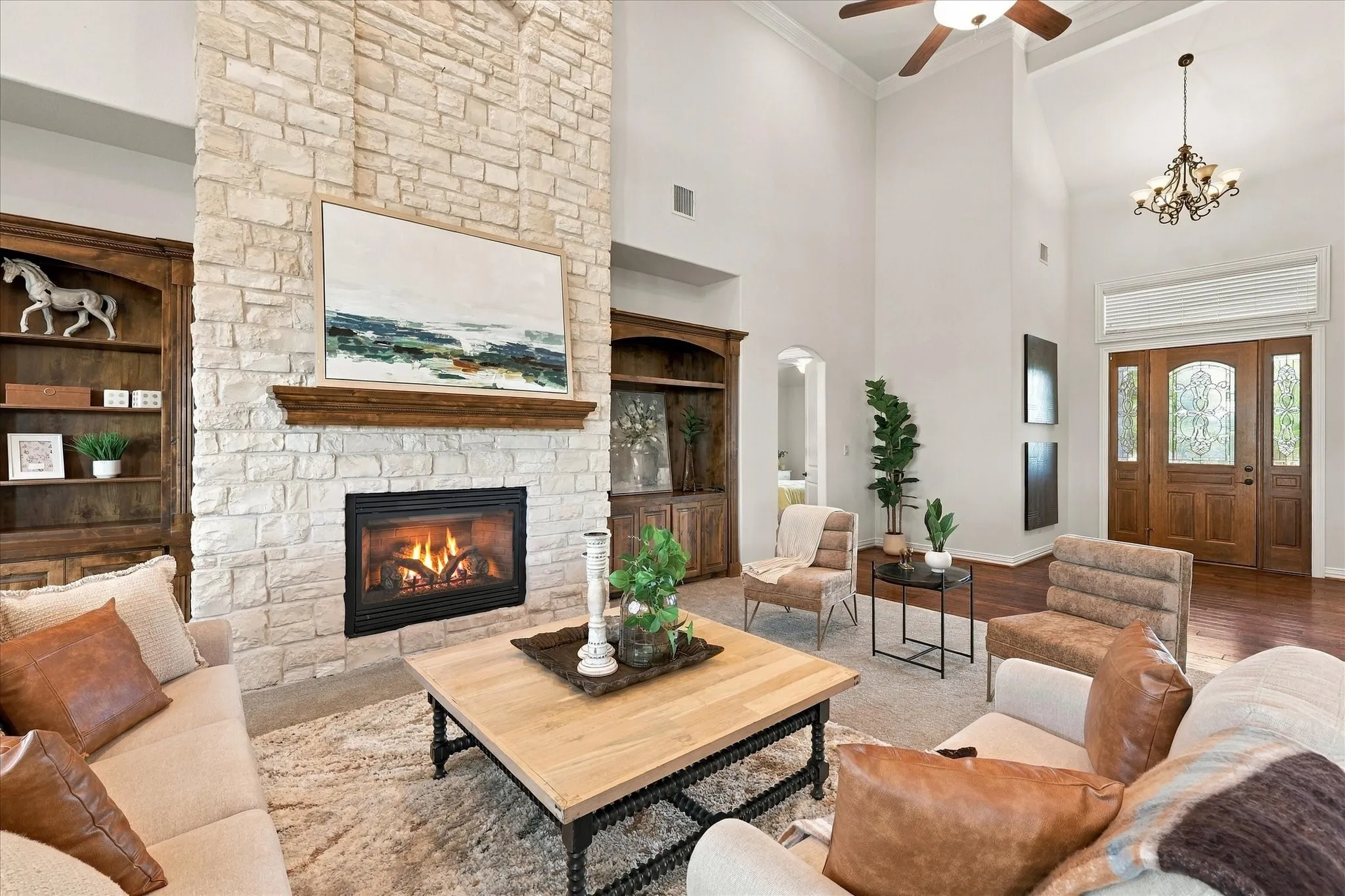 GORGEOUS living room with Austin Stone fireplace, floor to ceiling, surround