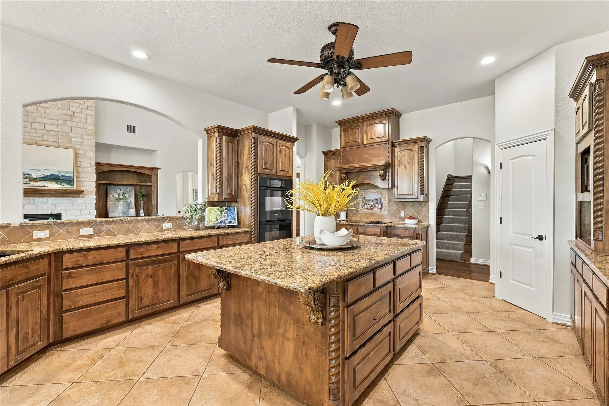 Large kitchen island with storage is a highlight of this chef's kitchen.  Double ovens!