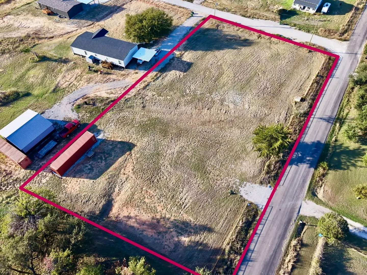 Expansive corner parcel featuring road frontage and clear, open terrain