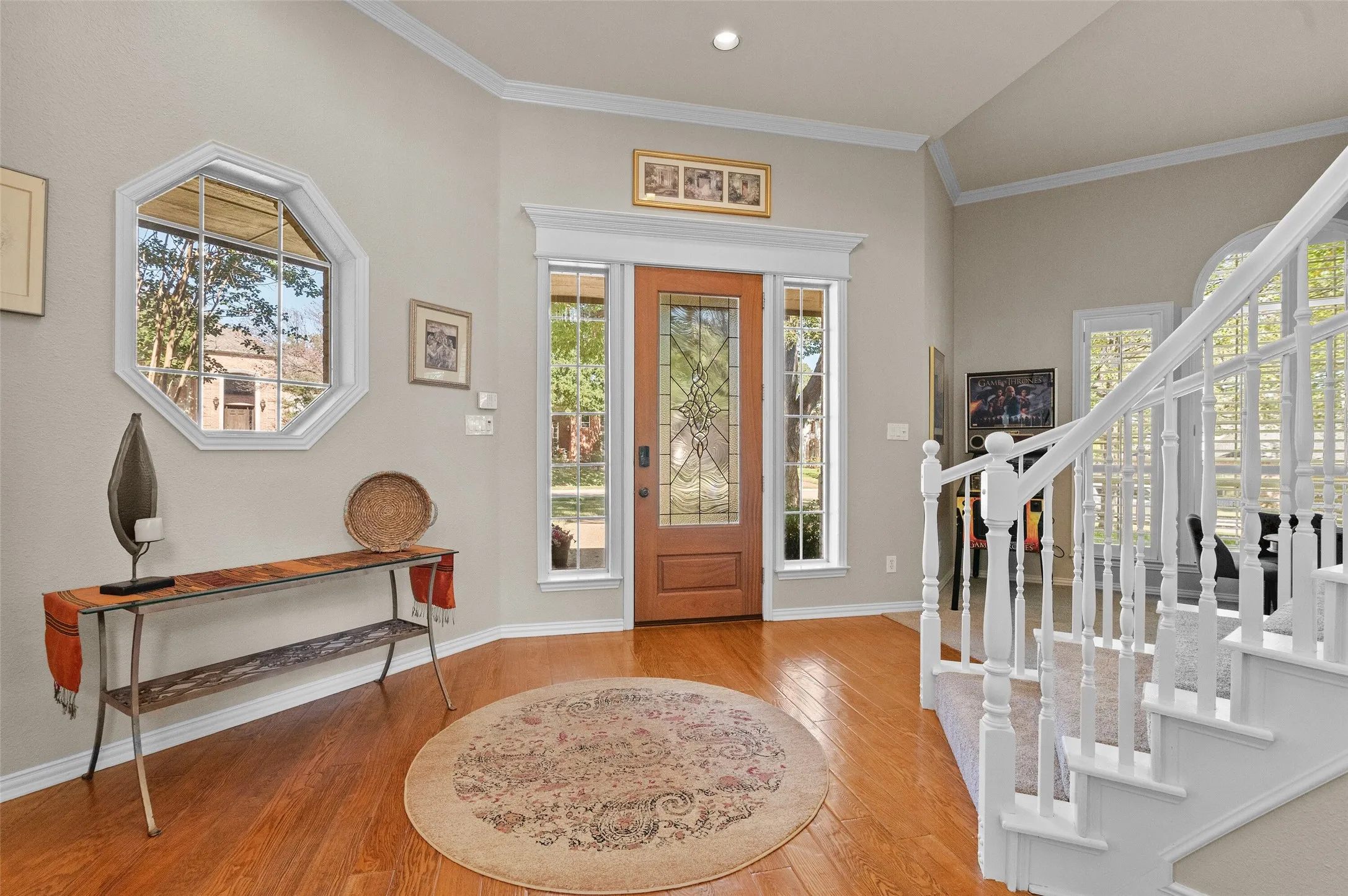 Elegant Entryway with wood floors and Staircase!