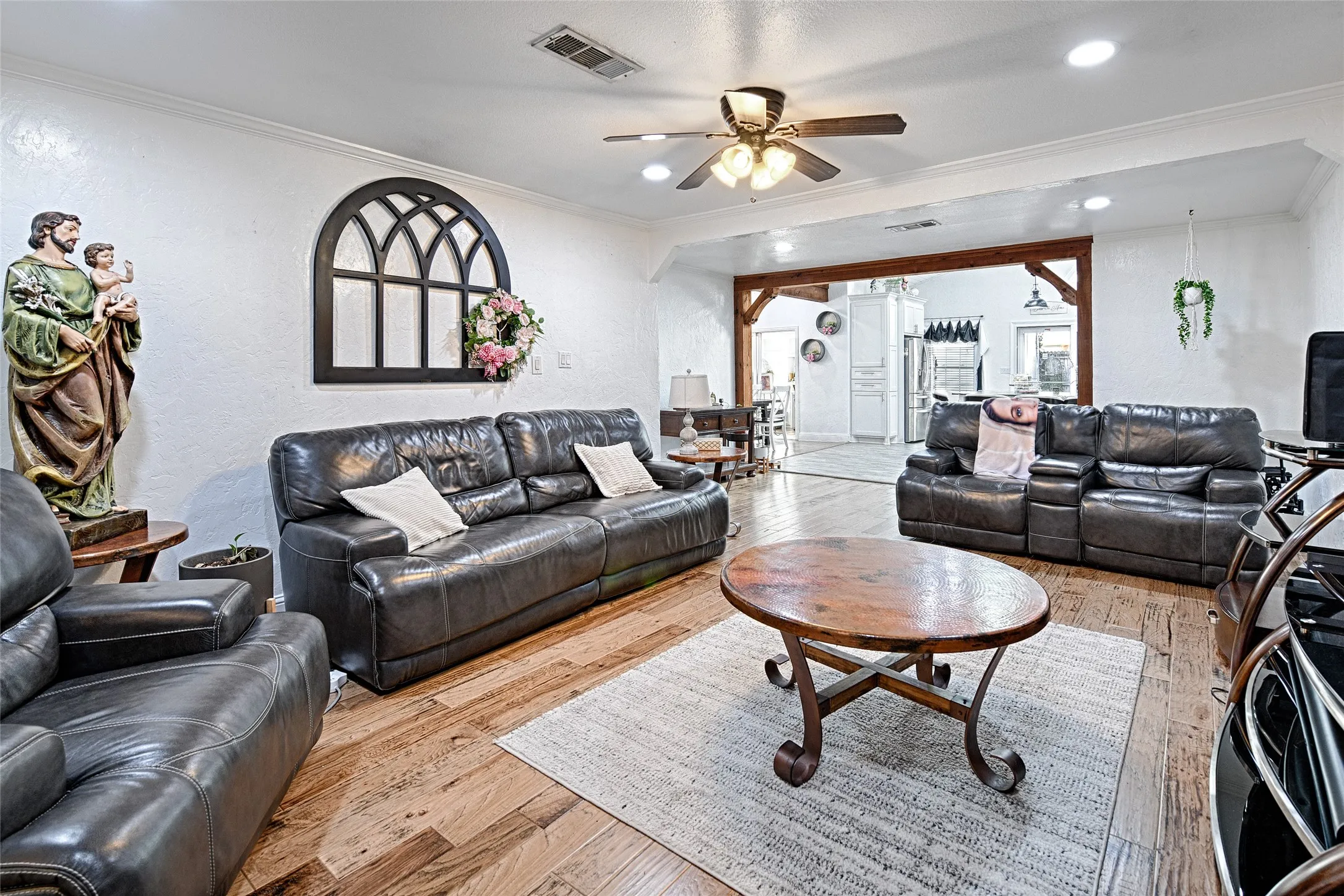 Spacious gathering area, wood flooring, recessed lighting