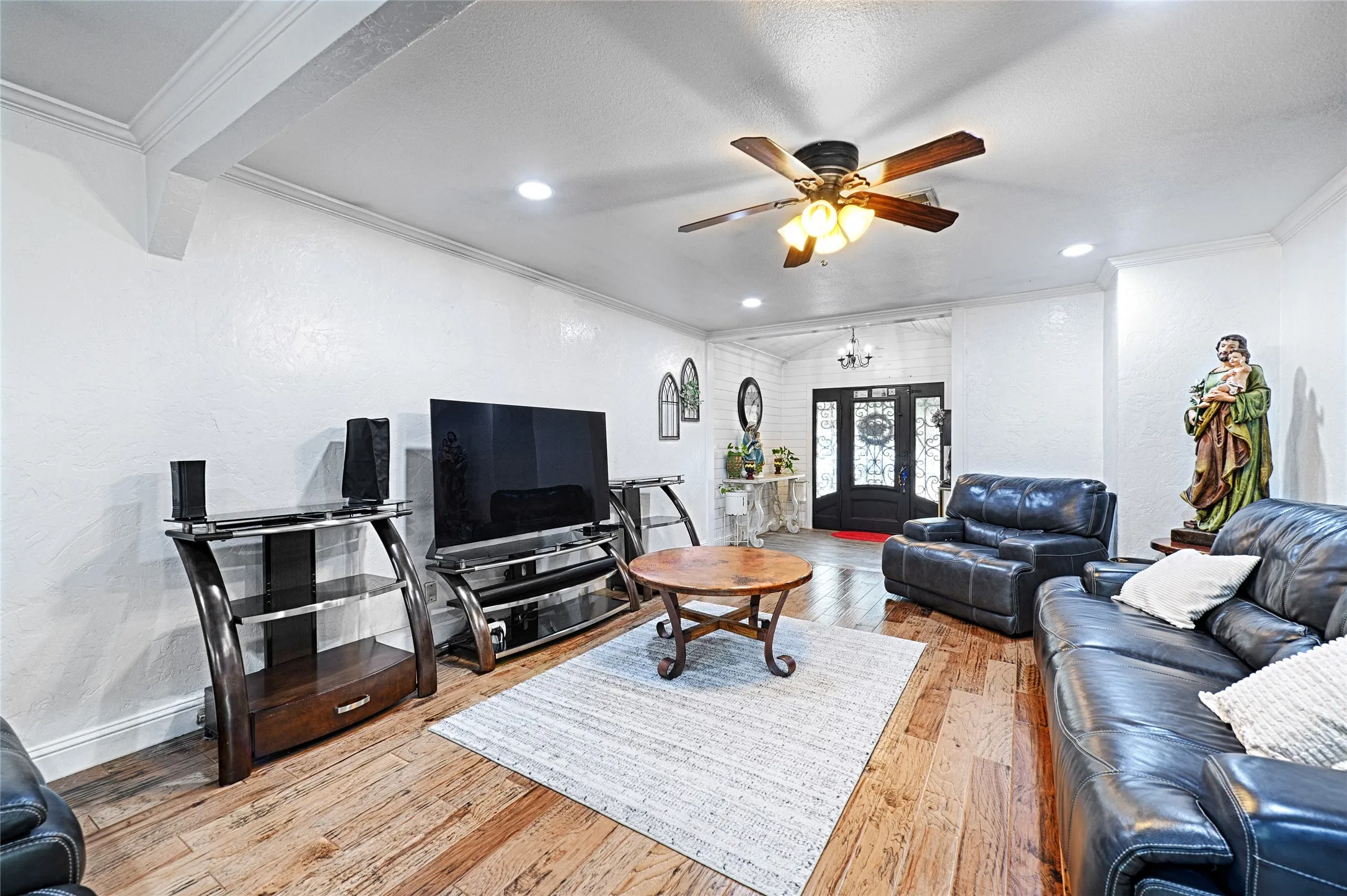 Ceiling fan, and decorative wood-trimmed opening