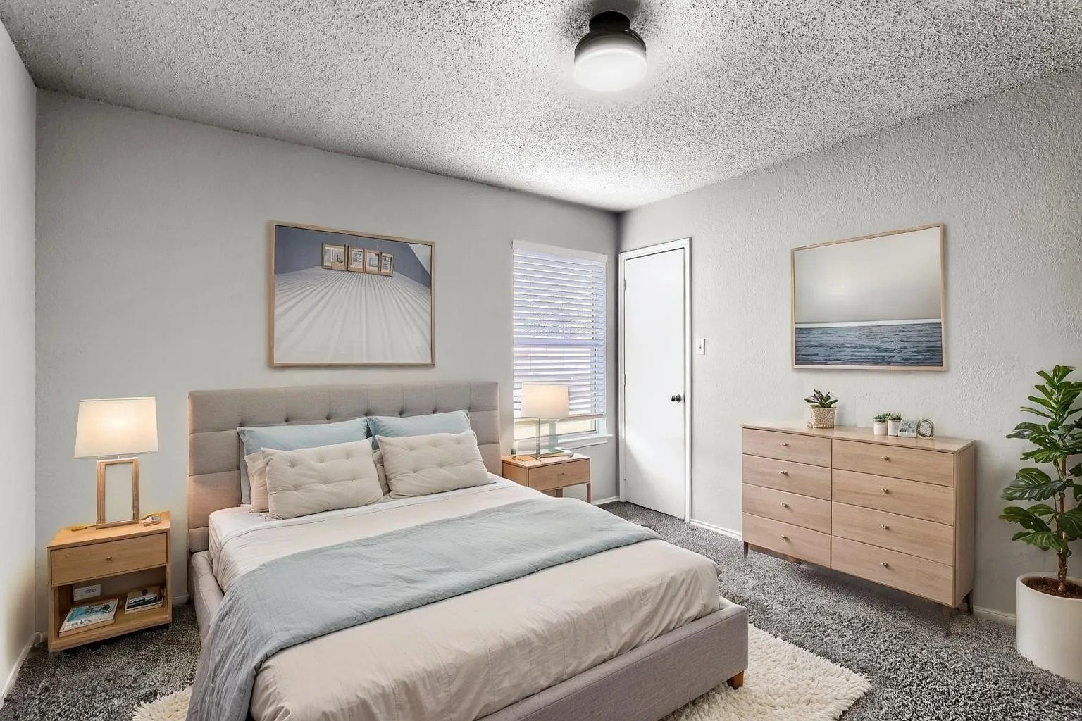 Virtually Staged -Neutral-toned room featuring wall-to-wall carpeting, textured ceiling, flush-mount lighting, and window blinds