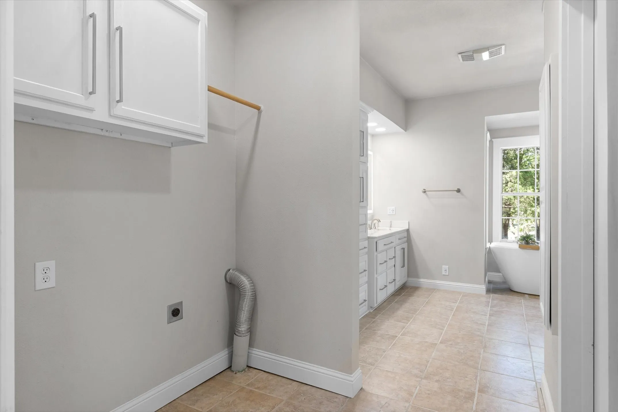 Laundry room is conveniently just off the master suite bath