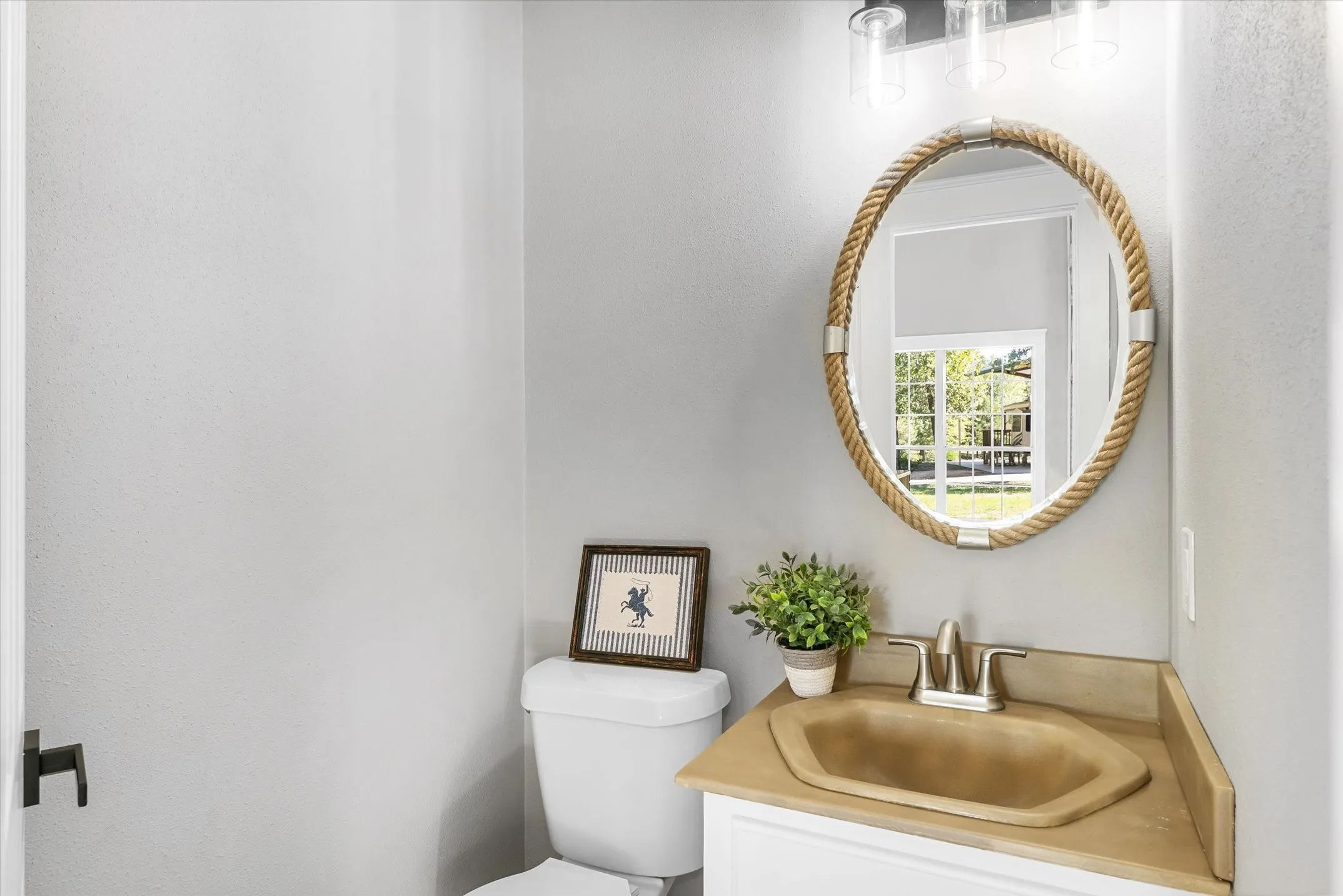 Half bath/guest bath just off the living room and kitchen
