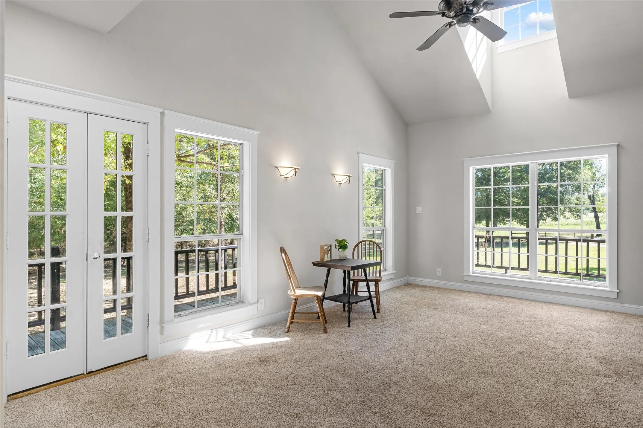 French doors in the primary suite lead to a porch to enjoy the country evenings and mornings