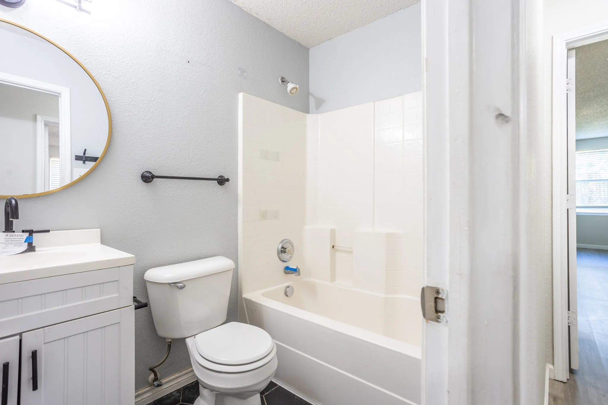 Hall bathroom with tub and shower combination