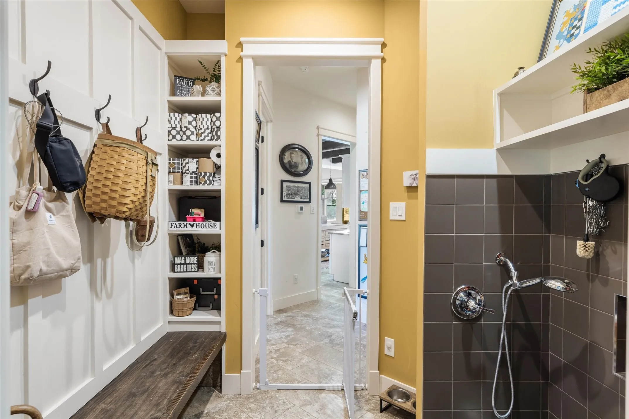 Mud room with a dog shower station!